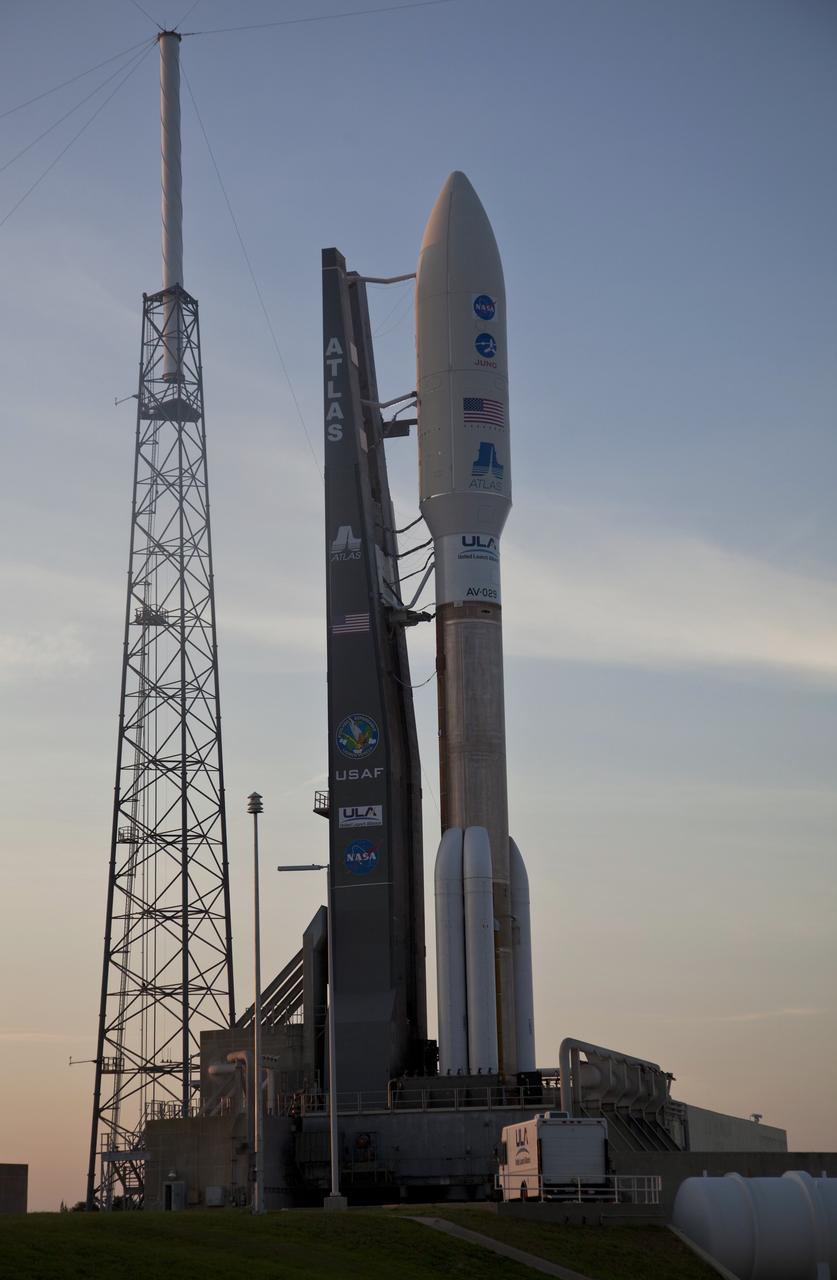 CAPE CANAVERAL, Fla. -- As the sun sets over Cape Canaveral Air Force Station in Florida, preparations are under way to launch the United Launch Alliance Atlas V-551 launch vehicle carrying NASA's Juno spacecraft from Space Launch Complex 41.    Liftoff is planned during a launch window which extends from 11:34 a.m. to 12:43 p.m. EDT on Aug. 5. The solar-powered spacecraft will orbit Jupiter's poles 33 times to find out more about the gas giant's origins, structure, atmosphere and magnetosphere and investigate the existence of a solid planetary core. NASA's Jet Propulsion Laboratory, Pasadena, Calif., manages the Juno mission for the principal investigator, Scott Bolton, of Southwest Research Institute in San Antonio. The Juno mission is part of the New Frontiers Program managed at NASA's Marshall Space Flight Center in Huntsville, Ala. Lockheed Martin Space Systems, Denver, built the spacecraft. Launch management for the mission is the responsibility of NASA's Launch Services Program at the Kennedy Space Center in Florida.  For more information, visit www.nasa.gov/juno. Photo credit: Courtesy of Scott Andrews