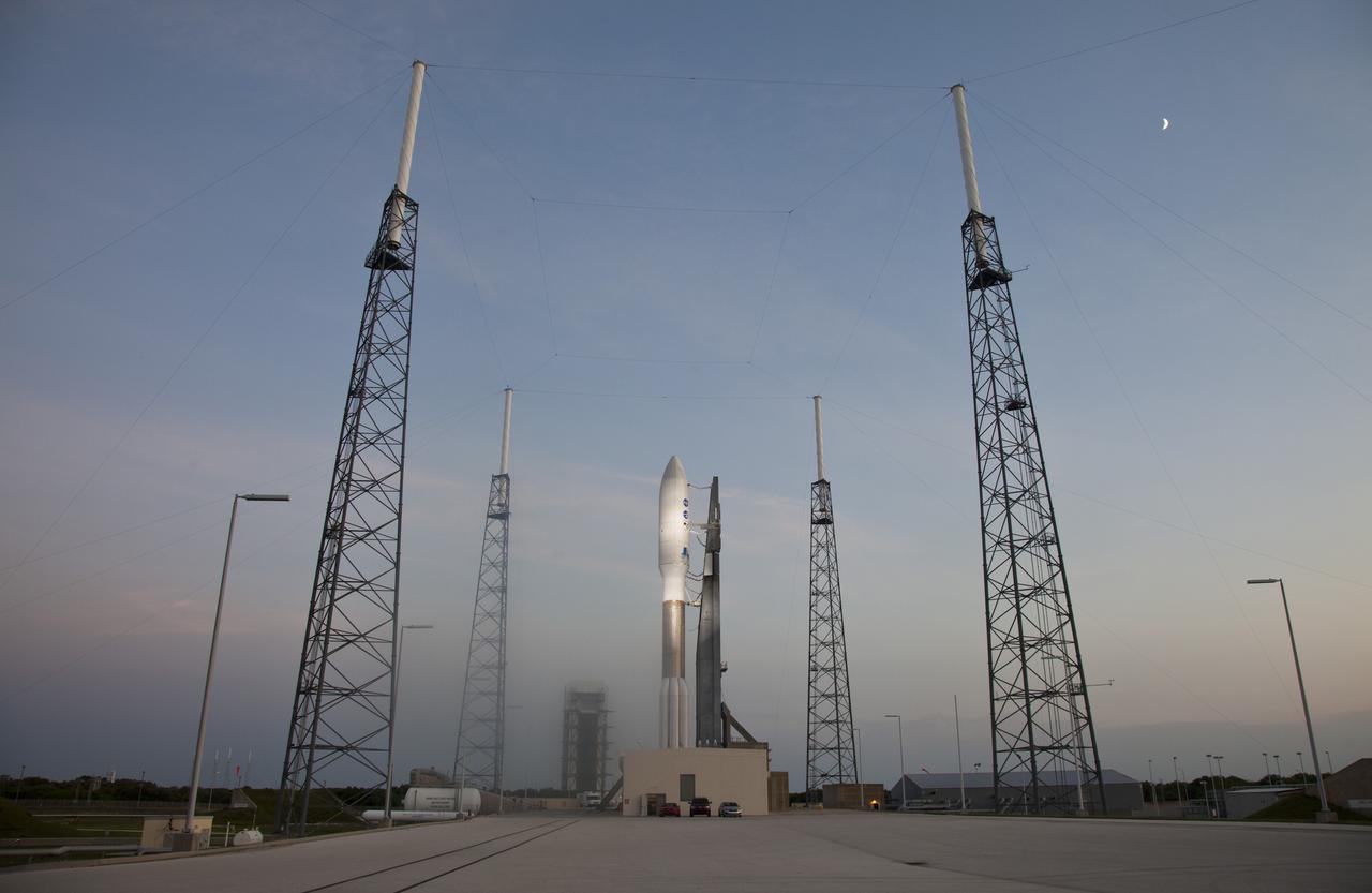 CAPE CANAVERAL, Fla. -- The moon comes into view over Space Launch Complex 41 at Cape Canaveral Air Force Station in Florida as final preparations to launch the United Launch Alliance Atlas V-551 launch vehicle carrying NASA's Juno spacecraft are completed on schedule.    Liftoff is planned during a launch window which extends from 11:34 a.m. to 12:43 p.m. EDT on Aug. 5. The solar-powered spacecraft will orbit Jupiter's poles 33 times to find out more about the gas giant's origins, structure, atmosphere and magnetosphere and investigate the existence of a solid planetary core. NASA's Jet Propulsion Laboratory, Pasadena, Calif., manages the Juno mission for the principal investigator, Scott Bolton, of Southwest Research Institute in San Antonio. The Juno mission is part of the New Frontiers Program managed at NASA's Marshall Space Flight Center in Huntsville, Ala. Lockheed Martin Space Systems, Denver, built the spacecraft. Launch management for the mission is the responsibility of NASA's Launch Services Program at the Kennedy Space Center in Florida.  For more information, visit www.nasa.gov/juno. Photo credit: Courtesy of Scott Andrews