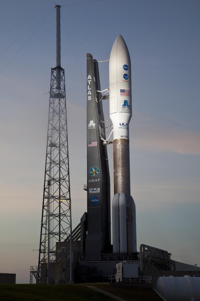 CAPE CANAVERAL, Fla. -- As night falls on Space Launch Complex 41 at Cape Canaveral Air Force Station in Florida, the lights are turned on to reveal the United Launch Alliance Atlas V-551 launch vehicle being readied for launch.  Atop the rocket is NASA's Juno planetary probe, enclosed in its payload fairing.    Liftoff is planned during a launch window which extends from 11:34 a.m. to 12:43 p.m. EDT on Aug. 5. The solar-powered spacecraft will orbit Jupiter's poles 33 times to find out more about the gas giant's origins, structure, atmosphere and magnetosphere and investigate the existence of a solid planetary core. NASA's Jet Propulsion Laboratory, Pasadena, Calif., manages the Juno mission for the principal investigator, Scott Bolton, of Southwest Research Institute in San Antonio. The Juno mission is part of the New Frontiers Program managed at NASA's Marshall Space Flight Center in Huntsville, Ala. Lockheed Martin Space Systems, Denver, built the spacecraft. Launch management for the mission is the responsibility of NASA's Launch Services Program at the Kennedy Space Center in Florida.  For more information, visit www.nasa.gov/juno. Photo credit: Courtesy of Scott Andrews