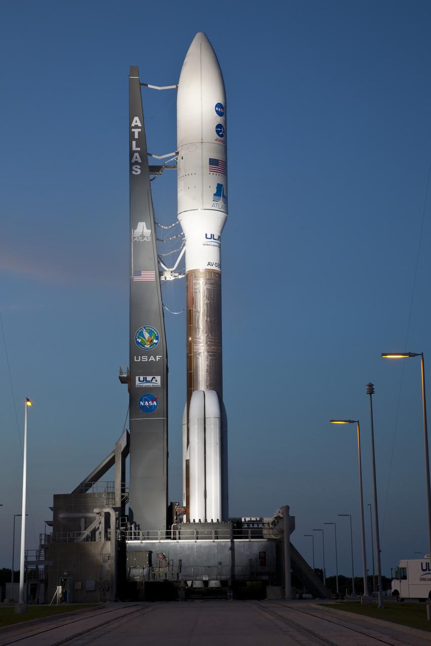 CAPE CANAVERAL, Fla. -- As night descends on Space Launch Complex 41 at Cape Canaveral Air Force Station in Florida, the United Launch Alliance Atlas V-551 launch vehicle is being readied for launch.  Atop the rocket is NASA's Juno planetary probe, enclosed in its payload fairing.    Liftoff is planned during a launch window which extends from 11:34 a.m. to 12:43 p.m. EDT on Aug. 5. The solar-powered spacecraft will orbit Jupiter's poles 33 times to find out more about the gas giant's origins, structure, atmosphere and magnetosphere and investigate the existence of a solid planetary core. NASA's Jet Propulsion Laboratory, Pasadena, Calif., manages the Juno mission for the principal investigator, Scott Bolton, of Southwest Research Institute in San Antonio. The Juno mission is part of the New Frontiers Program managed at NASA's Marshall Space Flight Center in Huntsville, Ala. Lockheed Martin Space Systems, Denver, built the spacecraft. Launch management for the mission is the responsibility of NASA's Launch Services Program at the Kennedy Space Center in Florida.  For more information, visit www.nasa.gov/juno. Photo credit: Courtesy of Scott Andrews