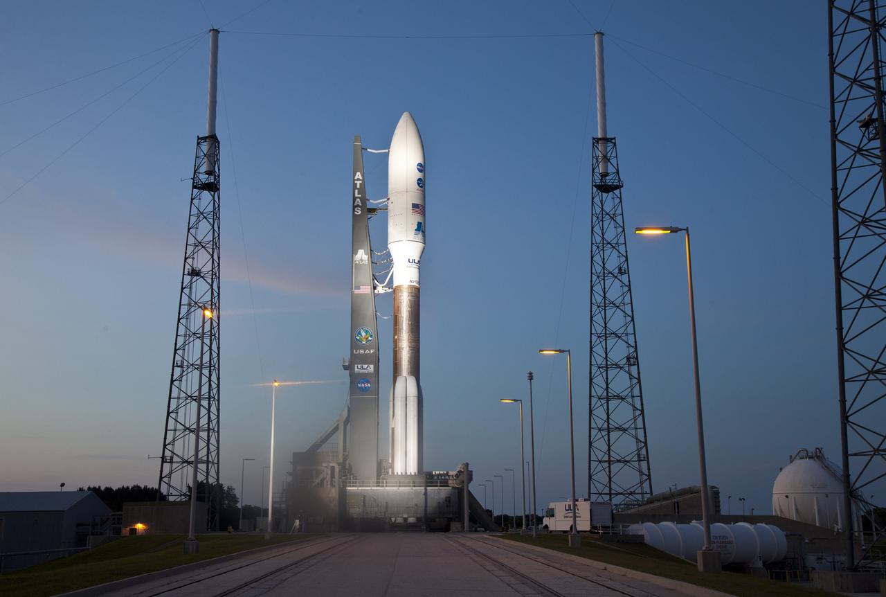 CAPE CANAVERAL, Fla. -- As night descends on Space Launch Complex 41 at Cape Canaveral Air Force Station in Florida, the United Launch Alliance Atlas V-551 launch vehicle is being readied for launch.  Atop the rocket is NASA's Juno planetary probe, enclosed in its payload fairing.    Liftoff is planned during a launch window which extends from 11:34 a.m. to 12:43 p.m. EDT on Aug. 5. The solar-powered spacecraft will orbit Jupiter's poles 33 times to find out more about the gas giant's origins, structure, atmosphere and magnetosphere and investigate the existence of a solid planetary core. NASA's Jet Propulsion Laboratory, Pasadena, Calif., manages the Juno mission for the principal investigator, Scott Bolton, of Southwest Research Institute in San Antonio. The Juno mission is part of the New Frontiers Program managed at NASA's Marshall Space Flight Center in Huntsville, Ala. Lockheed Martin Space Systems, Denver, built the spacecraft. Launch management for the mission is the responsibility of NASA's Launch Services Program at the Kennedy Space Center in Florida.  For more information, visit www.nasa.gov/juno. Photo credit: Courtesy of Scott Andrews