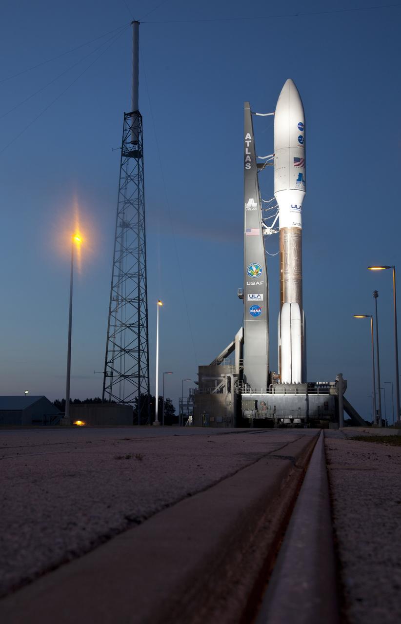 CAPE CANAVERAL, Fla. -- Nightfall on Space Launch Complex 41 at Cape Canaveral Air Force Station in Florida finds the United Launch Alliance Atlas V-551 launch vehicle being readied for launch.  Atop the rocket is NASA's Juno planetary probe, enclosed in its payload fairing.    Liftoff is planned during a launch window which extends from 11:34 a.m. to 12:43 p.m. EDT on Aug. 5. The solar-powered spacecraft will orbit Jupiter's poles 33 times to find out more about the gas giant's origins, structure, atmosphere and magnetosphere and investigate the existence of a solid planetary core. NASA's Jet Propulsion Laboratory, Pasadena, Calif., manages the Juno mission for the principal investigator, Scott Bolton, of Southwest Research Institute in San Antonio. The Juno mission is part of the New Frontiers Program managed at NASA's Marshall Space Flight Center in Huntsville, Ala. Lockheed Martin Space Systems, Denver, built the spacecraft. Launch management for the mission is the responsibility of NASA's Launch Services Program at the Kennedy Space Center in Florida.  For more information, visit www.nasa.gov/juno. Photo credit: Courtesy of Scott Andrews