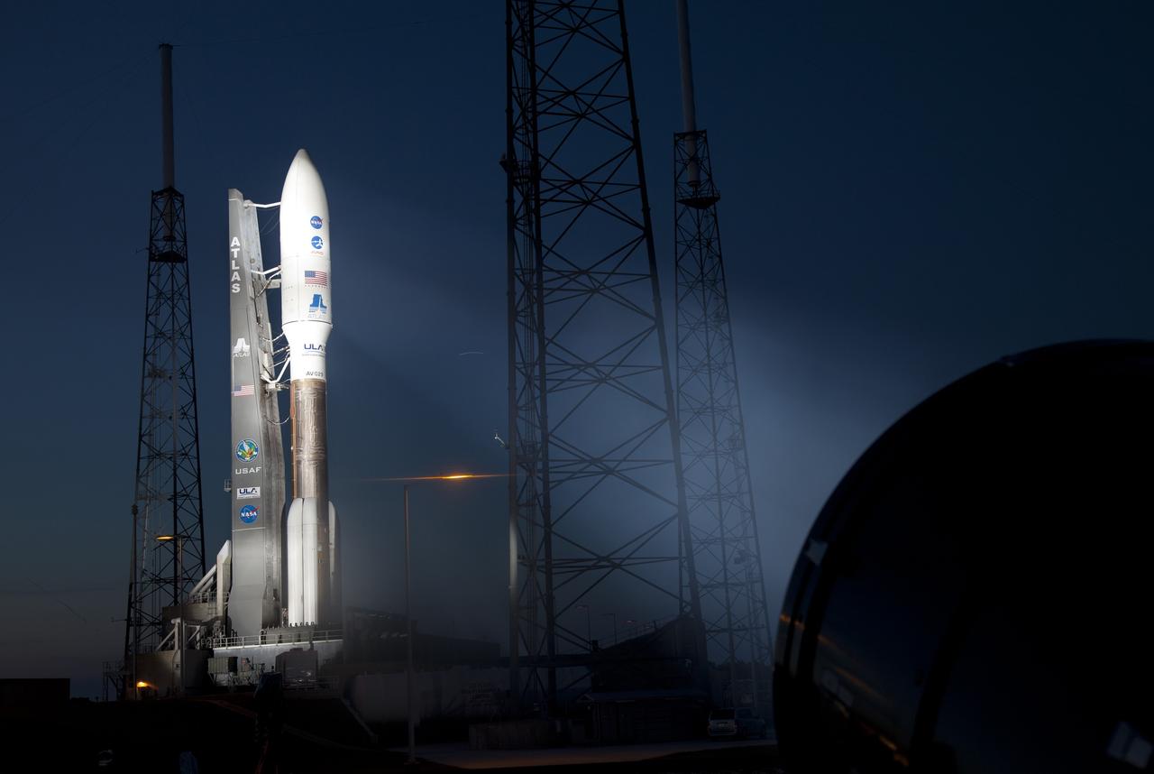 CAPE CANAVERAL, Fla. -- Nightfall on Space Launch Complex 41 at Cape Canaveral Air Force Station in Florida finds NASA's Juno planetary probe, enclosed in its payload fairing atop the United Launch Alliance Atlas V-551 launch vehicle, ready to begin its five-year journey to Jupiter.      Liftoff is planned during a launch window which extends from 11:34 a.m. to 12:43 p.m. EDT on Aug. 5. The solar-powered spacecraft will orbit Jupiter's poles 33 times to find out more about the gas giant's origins, structure, atmosphere and magnetosphere and investigate the existence of a solid planetary core. NASA's Jet Propulsion Laboratory, Pasadena, Calif., manages the Juno mission for the principal investigator, Scott Bolton, of Southwest Research Institute in San Antonio. The Juno mission is part of the New Frontiers Program managed at NASA's Marshall Space Flight Center in Huntsville, Ala. Lockheed Martin Space Systems, Denver, built the spacecraft. Launch management for the mission is the responsibility of NASA's Launch Services Program at the Kennedy Space Center in Florida.  For more information, visit www.nasa.gov/juno. Photo credit: Courtesy of Scott Andrews