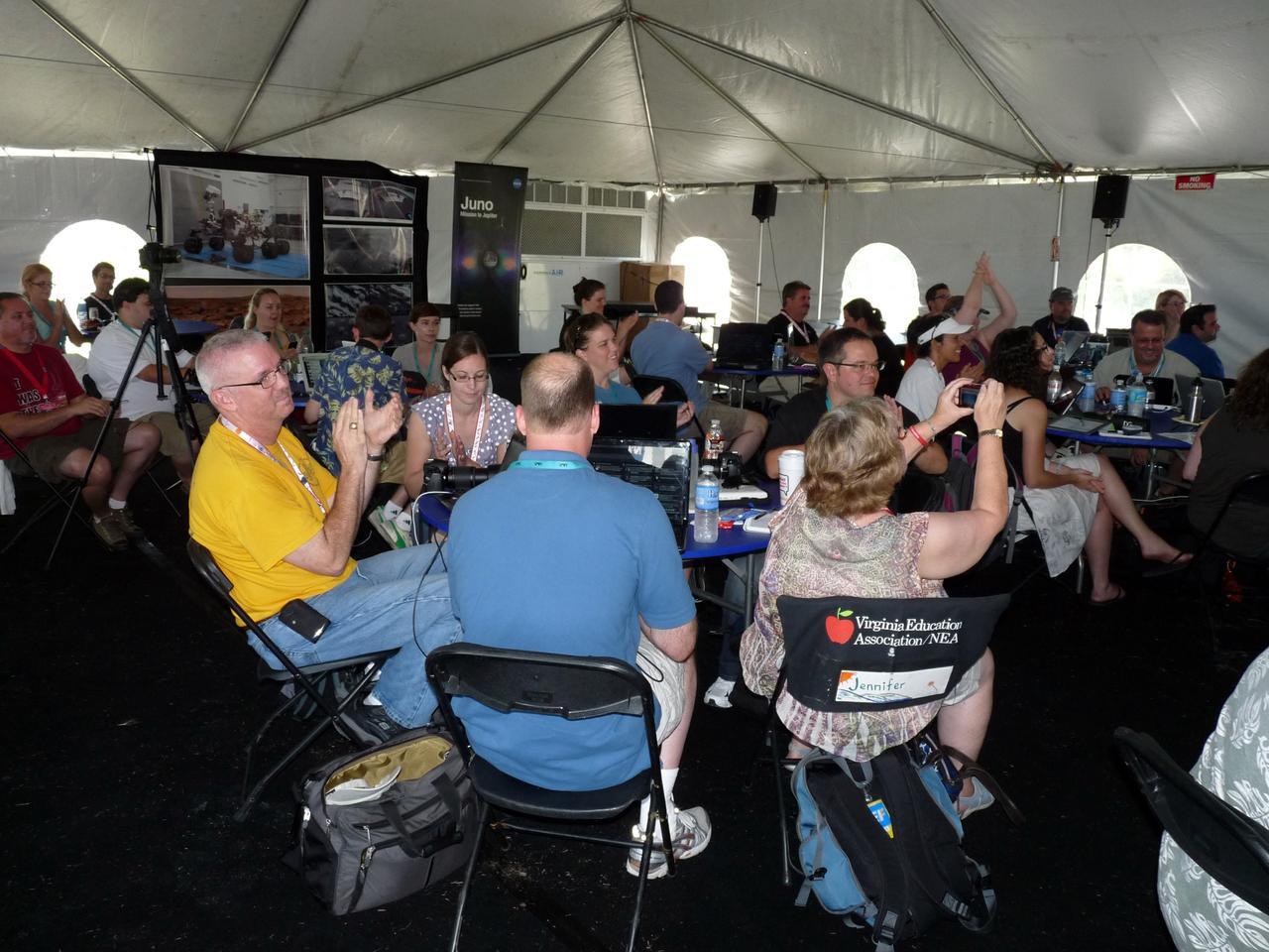 CAPE CANAVERAL, Fla. – At NASA’s Kennedy Space Center in Florida, about 150 followers of the agency’s Twitter account listen to presentations about NASA’s Juno mission to Jupiter during Tweetup activities inside a tent at the Press Site. The tweeters are at the center for two days of Juno prelaunch activities. Juno is NASA’s mission to Jupiter to study the giant planet and improve our understanding of the planet’s formation and evolution. The tweeters will share their experiences with followers through the social networking site Twitter.    Attendees represent 28 states, the District of Columbia and five other countries: Canada, Finland, Norway, Spain and the United Kingdom. This is the first time NASA has invited Twitter followers to experience the launch of a planetary spacecraft.  The Juno spacecraft is scheduled to launch on an Atlas V rocket from Space Launch Complex 41 at Cape Canaveral Air Force Station in Florida, Aug. 5, at 11:34 a.m. EDT.  For more information, visit http://www.nasa.gov/juno.  Photo credit: NASA/Fletcher Hildreth
