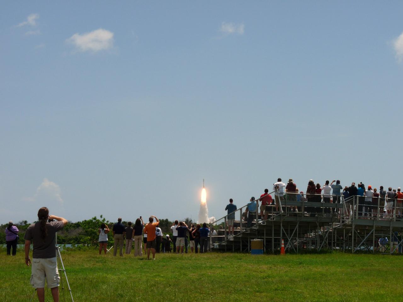 CAPE CANAVERAL, Fla. -- At the Press Site at NASA’s Kennedy Space Center in Florida, about 150 followers of the agency’s Twitter account view the launch of NASA's Juno planetary probe atop a United Launch Alliance Atlas V-551 rocket. The tweeters, in turn, will share their experiences with followers through the social networking site Twitter.    Liftoff was at 12:25 p.m. EDT Aug. 5 from Space Launch Complex 41 on Cape Canaveral Air Force Station in Florida. The solar-powered spacecraft will orbit Jupiter's poles 33 times to find out more about the gas giant's origins, structure, atmosphere and magnetosphere and investigate the existence of a solid planetary core. NASA's Jet Propulsion Laboratory, Pasadena, Calif., manages the Juno mission for the principal investigator, Scott Bolton, of Southwest Research Institute in San Antonio. The Juno mission is part of the New Frontiers Program managed at NASA's Marshall Space Flight Center in Huntsville, Ala. Lockheed Martin Space Systems, Denver, built the spacecraft. Launch management for the mission is the responsibility of NASA's Launch Services Program at the Kennedy Space Center in Florida.  For more information, visit www.nasa.gov/juno. Photo credit: NASA/Fletcher Hildreth
