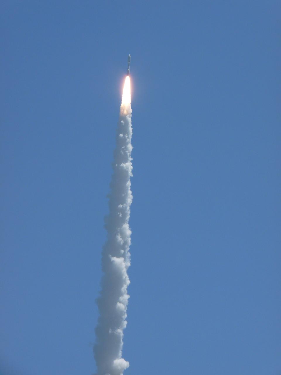 CAPE CANAVERAL, Fla. -- NASA's Juno planetary probe, enclosed in its payload fairing, begins its five-year journey to Jupiter atop a United Launch Alliance Atlas V-551 launch vehicle from Space Launch Complex 41 on Cape Canaveral Air Force Station in Florida.    Liftoff was at 12:25 p.m. EDT Aug. 5. The solar-powered spacecraft will orbit Jupiter's poles 33 times to find out more about the gas giant's origins, structure, atmosphere and magnetosphere and investigate the existence of a solid planetary core. NASA's Jet Propulsion Laboratory, Pasadena, Calif., manages the Juno mission for the principal investigator, Scott Bolton, of Southwest Research Institute in San Antonio. The Juno mission is part of the New Frontiers Program managed at NASA's Marshall Space Flight Center in Huntsville, Ala. Lockheed Martin Space Systems, Denver, built the spacecraft. Launch management for the mission is the responsibility of NASA's Launch Services Program at the Kennedy Space Center in Florida.  For more information, visit www.nasa.gov/juno. Photo credit: NASA/Fletcher Hildreth