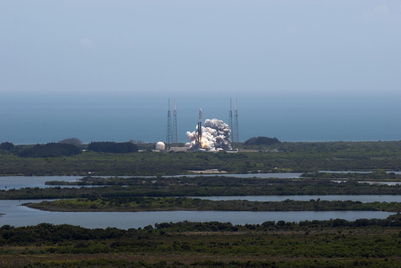 CAPE CANAVERAL, Fla. -- NASA's Juno planetary probe, enclosed in its payload fairing, begins its five-year journey to Jupiter atop a United Launch Alliance Atlas V-551 launch vehicle from Space Launch Complex 41 on Cape Canaveral Air Force Station in Florida.    Liftoff was at 12:25 p.m. EDT Aug. 5. The solar-powered spacecraft will orbit Jupiter's poles 33 times to find out more about the gas giant's origins, structure, atmosphere and magnetosphere and investigate the existence of a solid planetary core. NASA's Jet Propulsion Laboratory, Pasadena, Calif., manages the Juno mission for the principal investigator, Scott Bolton, of Southwest Research Institute in San Antonio. The Juno mission is part of the New Frontiers Program managed at NASA's Marshall Space Flight Center in Huntsville, Ala. Lockheed Martin Space Systems, Denver, built the spacecraft. Launch management for the mission is the responsibility of NASA's Launch Services Program at the Kennedy Space Center in Florida.  For more information, visit www.nasa.gov/juno. Photo credit: NASA/Jim Grossmann