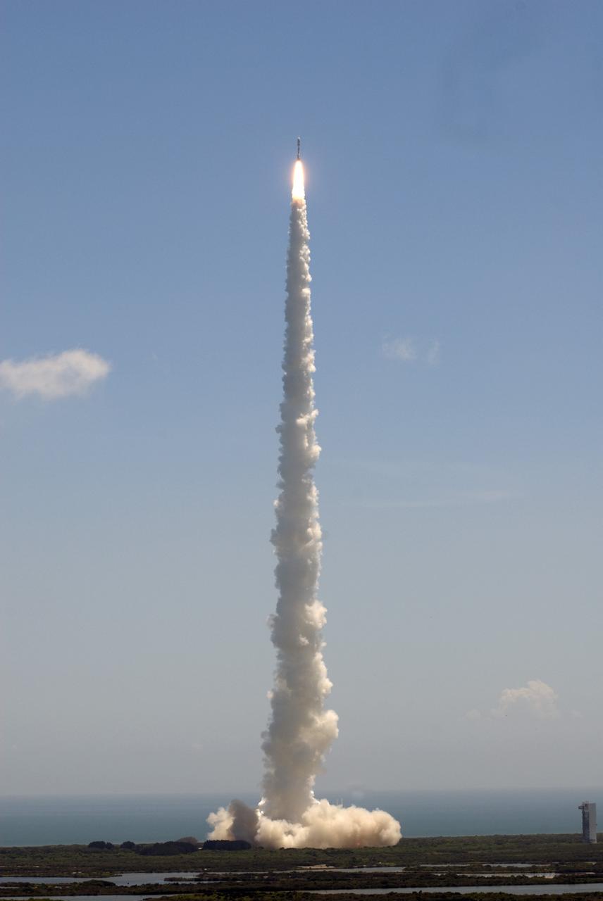 CAPE CANAVERAL, Fla. -- NASA's Juno planetary probe, enclosed in its payload fairing atop a United Launch Alliance Atlas V-551 launch vehicle, bounds from Space Launch Complex 41 into the clouds over Cape Canaveral Air Force Station in Florida.    Liftoff was at 12:25 p.m. EDT Aug. 5. The solar-powered spacecraft will orbit Jupiter's poles 33 times to find out more about the gas giant's origins, structure, atmosphere and magnetosphere and investigate the existence of a solid planetary core. NASA's Jet Propulsion Laboratory, Pasadena, Calif., manages the Juno mission for the principal investigator, Scott Bolton, of Southwest Research Institute in San Antonio. The Juno mission is part of the New Frontiers Program managed at NASA's Marshall Space Flight Center in Huntsville, Ala. Lockheed Martin Space Systems, Denver, built the spacecraft. Launch management for the mission is the responsibility of NASA's Launch Services Program at the Kennedy Space Center in Florida.  For more information, visit www.nasa.gov/juno. Photo credit: NASA/Jim Grossmann