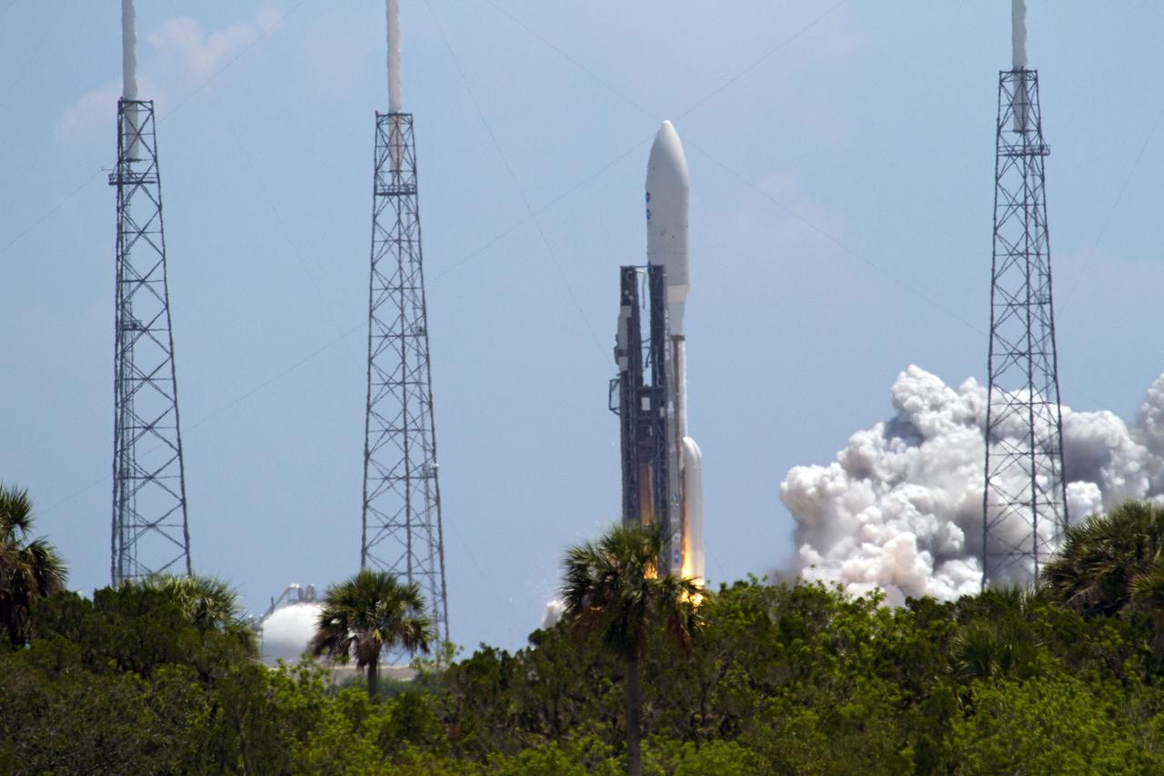 CAPE CANAVERAL, Fla. -- NASA's Juno planetary probe, enclosed in its payload fairing, begins its five-year journey to Jupiter atop a United Launch Alliance Atlas V-551 launch vehicle from Space Launch Complex 41 on Cape Canaveral Air Force Station in Florida.    Liftoff was at 12:25 p.m. EDT Aug. 5. The solar-powered spacecraft will orbit Jupiter's poles 33 times to find out more about the gas giant's origins, structure, atmosphere and magnetosphere and investigate the existence of a solid planetary core. NASA's Jet Propulsion Laboratory, Pasadena, Calif., manages the Juno mission for the principal investigator, Scott Bolton, of Southwest Research Institute in San Antonio. The Juno mission is part of the New Frontiers Program managed at NASA's Marshall Space Flight Center in Huntsville, Ala. Lockheed Martin Space Systems, Denver, built the spacecraft. Launch management for the mission is the responsibility of NASA's Launch Services Program at the Kennedy Space Center in Florida.  For more information, visit www.nasa.gov/juno. Photo credit: NASA/Kenny Allen