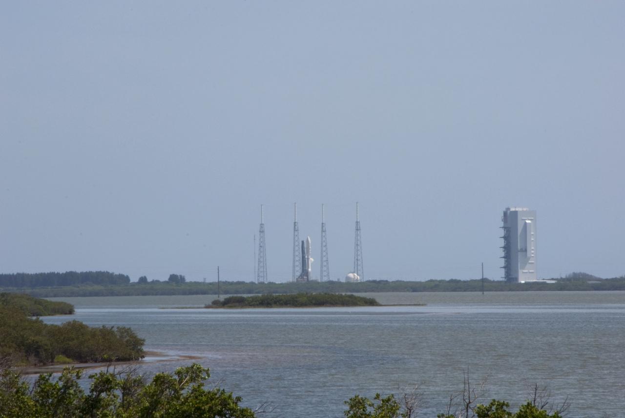 CAPE CANAVERAL, Fla. -- NASA's Juno planetary probe is moments away from beginning its five-year journey to Jupiter atop a United Launch Alliance Atlas V-551 launch vehicle from Space Launch Complex 41 on Cape Canaveral Air Force Station in Florida.  At right is the Vertical Integration Facility where the vehicle was stacked.    Liftoff was at 12:25 p.m. EDT Aug. 5. The solar-powered spacecraft will orbit Jupiter's poles 33 times to find out more about the gas giant's origins, structure, atmosphere and magnetosphere and investigate the existence of a solid planetary core. NASA's Jet Propulsion Laboratory, Pasadena, Calif., manages the Juno mission for the principal investigator, Scott Bolton, of Southwest Research Institute in San Antonio. The Juno mission is part of the New Frontiers Program managed at NASA's Marshall Space Flight Center in Huntsville, Ala. Lockheed Martin Space Systems, Denver, built the spacecraft. Launch management for the mission is the responsibility of NASA's Launch Services Program at the Kennedy Space Center in Florida.  For more information, visit www.nasa.gov/juno. Photo credit: NASA/Alan Ault