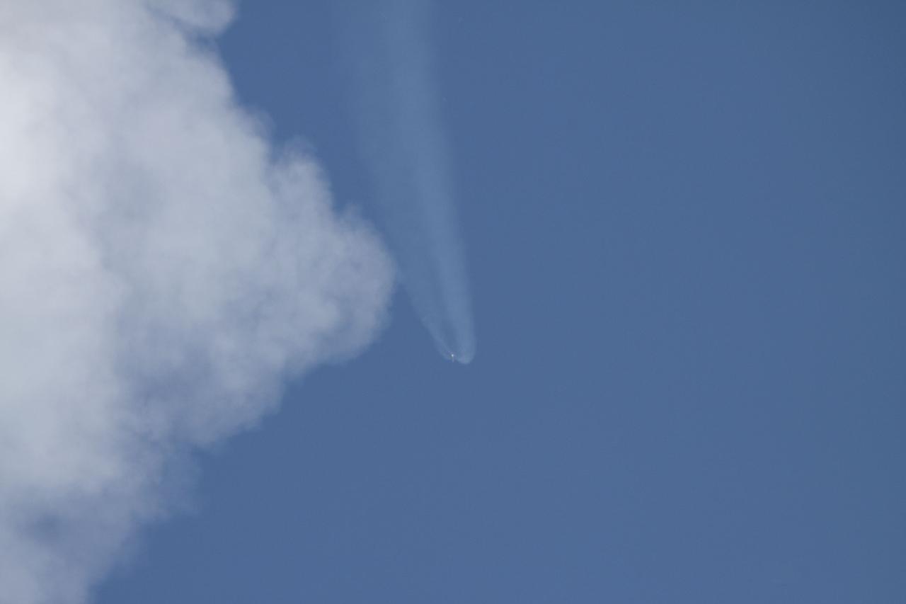 CAPE CANAVERAL, Fla. -- NASA's Juno planetary probe, atop a United Launch Alliance Atlas V-551 launch vehicle, races past the clouds over Space Launch Complex 41 at Cape Canaveral Air Force Station in Florida.    Liftoff was at 12:25 p.m. EDT Aug. 5. The solar-powered spacecraft will orbit Jupiter's poles 33 times to find out more about the gas giant's origins, structure, atmosphere and magnetosphere and investigate the existence of a solid planetary core. NASA's Jet Propulsion Laboratory, Pasadena, Calif., manages the Juno mission for the principal investigator, Scott Bolton, of Southwest Research Institute in San Antonio. The Juno mission is part of the New Frontiers Program managed at NASA's Marshall Space Flight Center in Huntsville, Ala. Lockheed Martin Space Systems, Denver, built the spacecraft. Launch management for the mission is the responsibility of NASA's Launch Services Program at the Kennedy Space Center in Florida.  For more information, visit www.nasa.gov/juno. Photo credit: NASA/Ken Thornsley