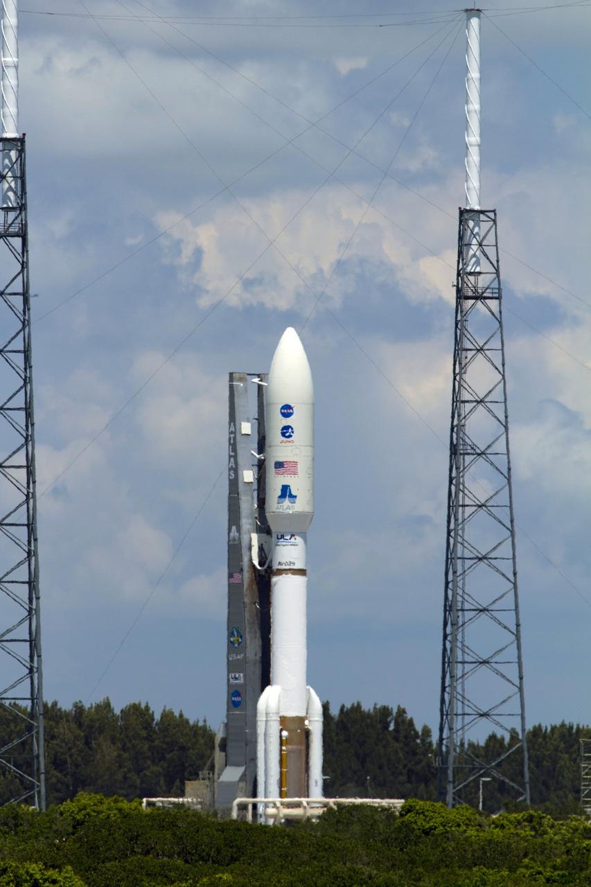 CAPE CANAVERAL, Fla. -- NASA's Juno planetary probe is moments away from beginning its five-year journey to Jupiter atop a United Launch Alliance Atlas V-551 launch vehicle from Space Launch Complex 41 on Cape Canaveral Air Force Station in Florida.     Liftoff was at 12:25 p.m. EDT Aug. 5. The solar-powered spacecraft will orbit Jupiter's poles 33 times to find out more about the gas giant's origins, structure, atmosphere and magnetosphere and investigate the existence of a solid planetary core. NASA's Jet Propulsion Laboratory, Pasadena, Calif., manages the Juno mission for the principal investigator, Scott Bolton, of Southwest Research Institute in San Antonio. The Juno mission is part of the New Frontiers Program managed at NASA's Marshall Space Flight Center in Huntsville, Ala. Lockheed Martin Space Systems, Denver, built the spacecraft. Launch management for the mission is the responsibility of NASA's Launch Services Program at the Kennedy Space Center in Florida.  For more information, visit www.nasa.gov/juno. Photo credit: NASA/George Roberts and Rusty Backer