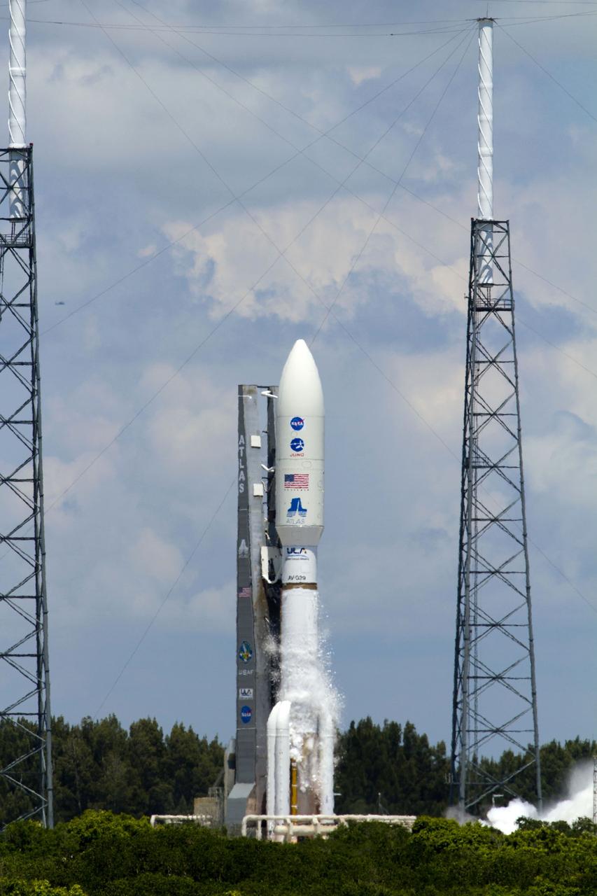 CAPE CANAVERAL, Fla. -- Frost breaks away from the first stage of the United Launch Alliance Atlas V-551 launch vehicle carrying NASA's Juno planetary probe as it begins to vibrate on the pad before launch at Space Launch Complex 41 on Cape Canaveral Air Force Station in Florida.  The frost forms when the stage is filled with its supercold liquid oxygen fuel.     Liftoff was at 12:25 p.m. EDT Aug. 5. The solar-powered spacecraft will orbit Jupiter's poles 33 times to find out more about the gas giant's origins, structure, atmosphere and magnetosphere and investigate the existence of a solid planetary core. NASA's Jet Propulsion Laboratory, Pasadena, Calif., manages the Juno mission for the principal investigator, Scott Bolton, of Southwest Research Institute in San Antonio. The Juno mission is part of the New Frontiers Program managed at NASA's Marshall Space Flight Center in Huntsville, Ala. Lockheed Martin Space Systems, Denver, built the spacecraft. Launch management for the mission is the responsibility of NASA's Launch Services Program at the Kennedy Space Center in Florida.  For more information, visit www.nasa.gov/juno. Photo credit: NASA/George Roberts and Rusty Backer