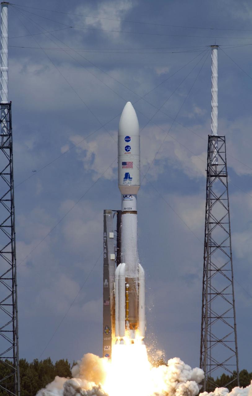 CAPE CANAVERAL, Fla. -- Frost breaks away from the first stage of the United Launch Alliance Atlas V-551 launch vehicle carrying NASA's Juno planetary probe as it lifts off the pad at Space Launch Complex 41 on Cape Canaveral Air Force Station in Florida.  The frost forms when the stage is filled with its supercold liquid oxygen fuel.    Liftoff was at 12:25 p.m. EDT Aug. 5. The solar-powered spacecraft will orbit Jupiter's poles 33 times to find out more about the gas giant's origins, structure, atmosphere and magnetosphere and investigate the existence of a solid planetary core. NASA's Jet Propulsion Laboratory, Pasadena, Calif., manages the Juno mission for the principal investigator, Scott Bolton, of Southwest Research Institute in San Antonio. The Juno mission is part of the New Frontiers Program managed at NASA's Marshall Space Flight Center in Huntsville, Ala. Lockheed Martin Space Systems, Denver, built the spacecraft. Launch management for the mission is the responsibility of NASA's Launch Services Program at the Kennedy Space Center in Florida.  For more information, visit www.nasa.gov/juno. Photo credit: NASA/George Roberts and Rusty Backer