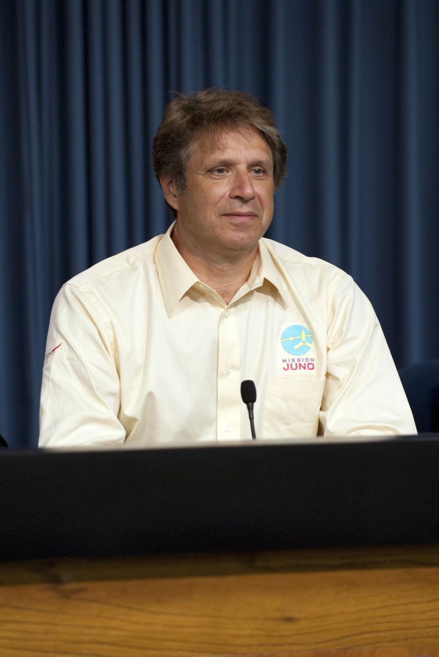 CAPE CANAVERAL, Fla. -- Scott Bolton, Juno's principal investigator at the Southwest Research Institute (SWRI), talks to media representative during a post-launch news conference following the successful liftoff of the Juno spacecraft atop a United Launch Alliance Atlas V rocket. Launch was at 12:25 p.m. EDT Aug. 5. The solar-powered spacecraft now is on a five-year journey to Jupiter, where it will orbit the planet's poles 33 times to find out more about the gas giant's origins, structure, atmosphere and magnetosphere and investigate the existence of a solid planetary core. For more information, visit www.nasa.gov/juno. Photo credit: Kim Shiflett