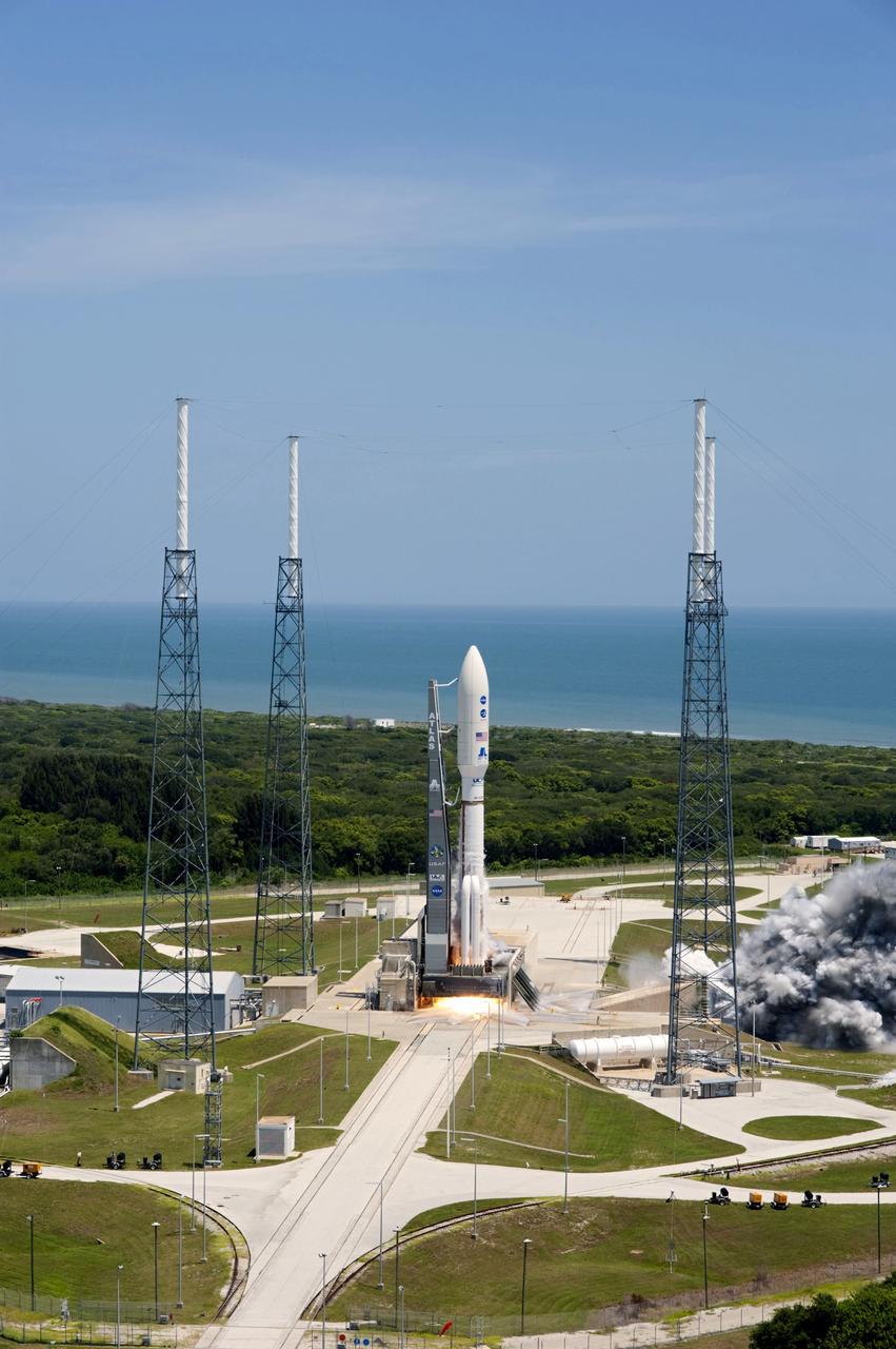 CAPE CANAVERAL, Fla. -- Backdropped by the Atlantic Ocean and surrounded by its four-tower lightning protection system, NASA's Juno planetary probe, enclosed in its payload fairing, is seconds away from liftoff atop a United Launch Alliance Atlas V rocket. Leaving from Space Launch Complex 41 on Cape Canaveral Air Force Station in Florida, the spacecraft will embark on a five-year journey to Jupiter.      Liftoff was at 12:25 p.m. EDT Aug. 5. The solar-powered spacecraft will orbit Jupiter's poles 33 times to find out more about the gas giant's origins, structure, atmosphere and magnetosphere and investigate the existence of a solid planetary core. For more information, visit www.nasa.gov/juno. Photo credit: NASA/Tony Gray and Tim Powers