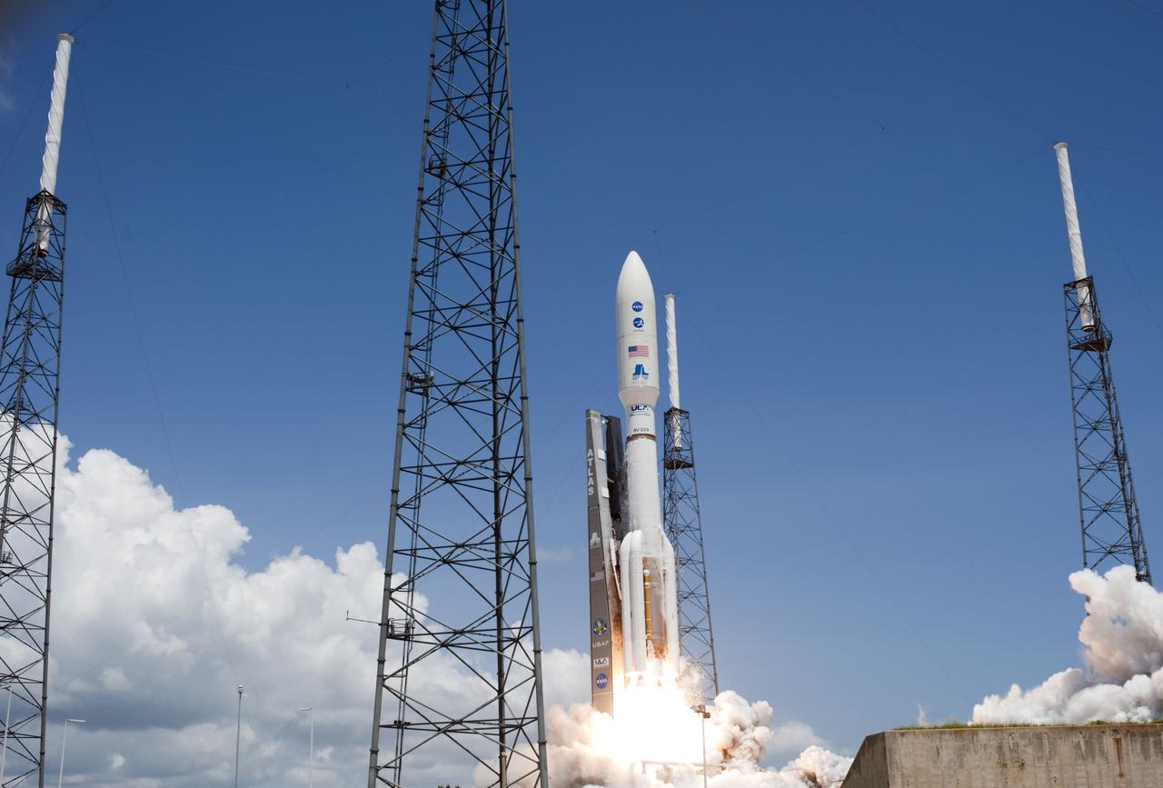 CAPE CANAVERAL, Fla. -- Fire lights up a crystal-clear blue sky on Space Launch Complex 41 on Cape Canaveral Air Force Station in Florida as a United Launch Alliance Atlas V rocket lofts NASA's Juno planetary probe into space.       Liftoff was at 12:25 p.m. EDT Aug. 5. The solar-powered spacecraft will orbit Jupiter's poles 33 times to find out more about the gas giant's origins, structure, atmosphere and magnetosphere and investigate the existence of a solid planetary core. For more information, visit www.nasa.gov/juno. Photo credit: NASA/Tony Gray and Don Kight