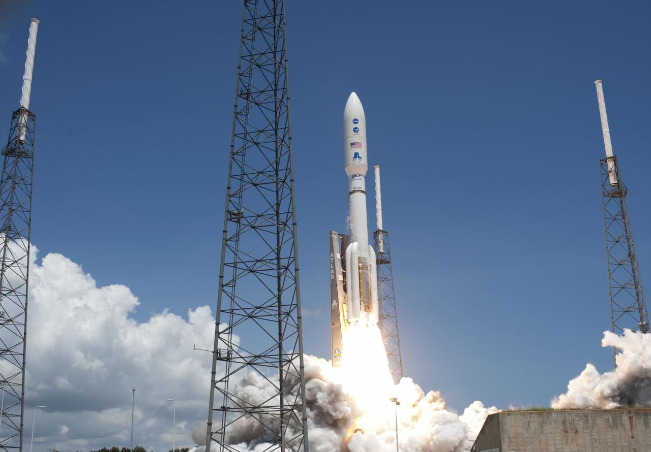 CAPE CANAVERAL, Fla. -- Fire lights up a crystal-clear blue sky on Space Launch Complex 41 on Cape Canaveral Air Force Station in Florida as a United Launch Alliance Atlas V rocket lofts NASA's Juno planetary probe into space.         Liftoff was at 12:25 p.m. EDT Aug. 5. The solar-powered spacecraft will orbit Jupiter's poles 33 times to find out more about the gas giant's origins, structure, atmosphere and magnetosphere and investigate the existence of a solid planetary core. For more information, visit www.nasa.gov/juno. Photo credit: NASA/Tony Gray and Don Kight