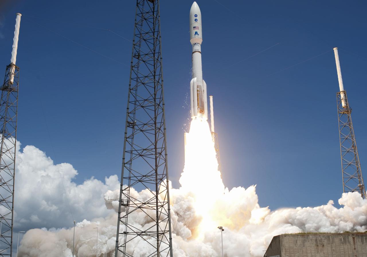 CAPE CANAVERAL, Fla. -- Fire lights up a crystal-clear blue sky on Space Launch Complex 41 on Cape Canaveral Air Force Station in Florida as a United Launch Alliance Atlas V rocket lofts NASA's Juno planetary probe into space.       Liftoff was at 12:25 p.m. EDT Aug. 5. The solar-powered spacecraft will orbit Jupiter's poles 33 times to find out more about the gas giant's origins, structure, atmosphere and magnetosphere and investigate the existence of a solid planetary core. For more information, visit www.nasa.gov/juno. Photo credit: NASA/Tony Gray and Don Kight