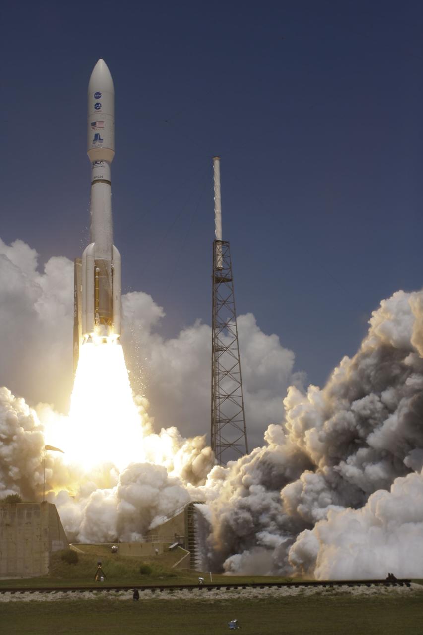 CAPE CANAVERAL, Fla. -- Rising from fire and smoke, NASA's Juno planetary probe, enclosed in its payload fairing, launches atop a United Launch Alliance Atlas V rocket. Leaving from Space Launch Complex 41 on Cape Canaveral Air Force Station in Florida, the spacecraft will embark on a five-year journey to Jupiter.        Liftoff was at 12:25 p.m. EDT Aug. 5. The solar-powered spacecraft will orbit Jupiter's poles 33 times to find out more about the gas giant's origins, structure, atmosphere and magnetosphere and investigate the existence of a solid planetary core. For more information, visit www.nasa.gov/juno. Photo credit: Courtesy Scott Andrews