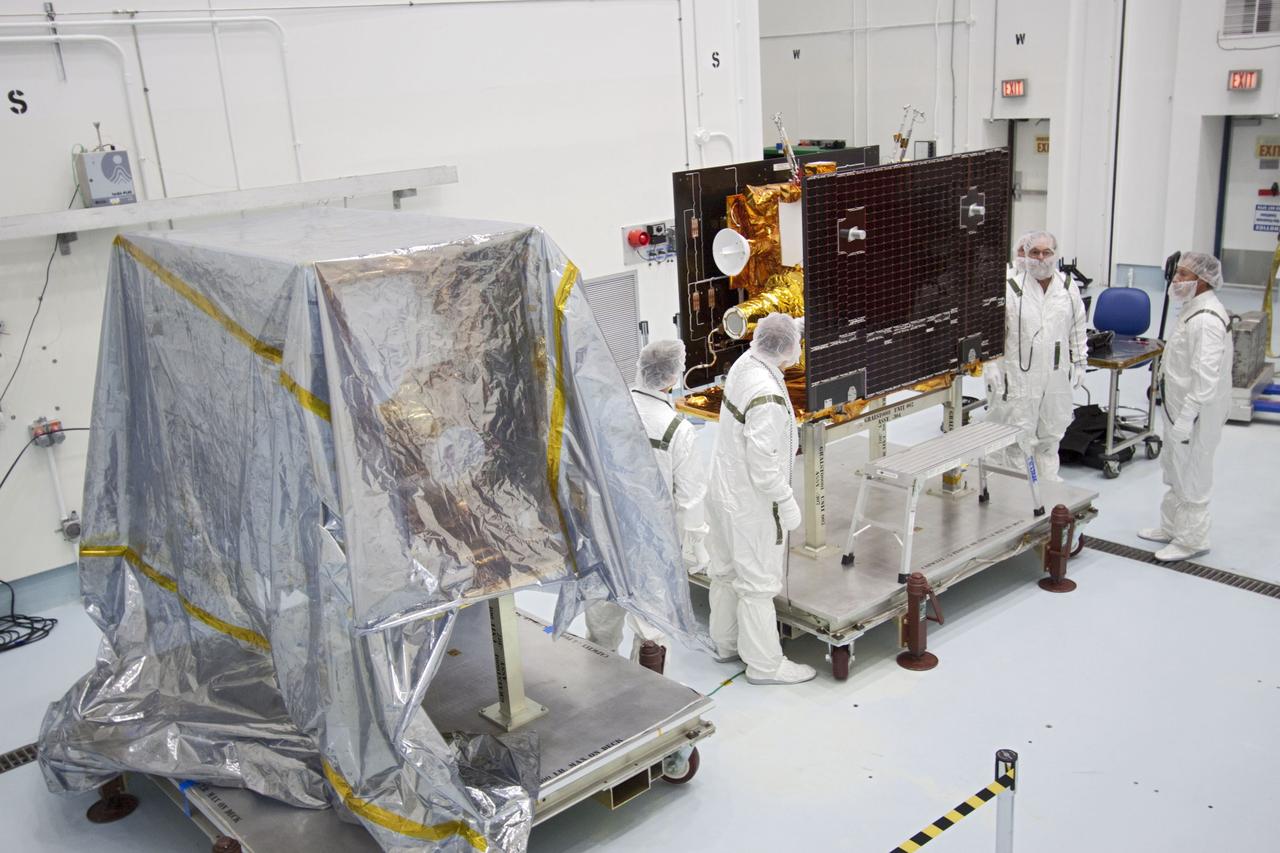 CAPE CANAVERAL, Fla. -- At Astrotech Space Operation's payload processing facility in Titusville, Fla., Lockheed Martin technicians determine the readiness of one of NASA's twin Gravity Recovery and Interior Laboratory lunar spacecraft before the spacecraft are stacked in their launch configuration in preparation for transport to the launch pad. GRAIL will fly in tandem orbits around the moon for several months to measure its gravity field. GRAIL's primary science objectives are to determine the structure of the lunar interior, from crust to core, and to advance understanding of the thermal evolution of the moon. Launch aboard a United Launch Alliance Delta II rocket from Space Launch Complex 17B on Cape Canaveral Air Force Station is scheduled for Sept. 8. For more information, visit http://www.nasa.gov/grail. Photo credit: NASA/Jim Grossmann
