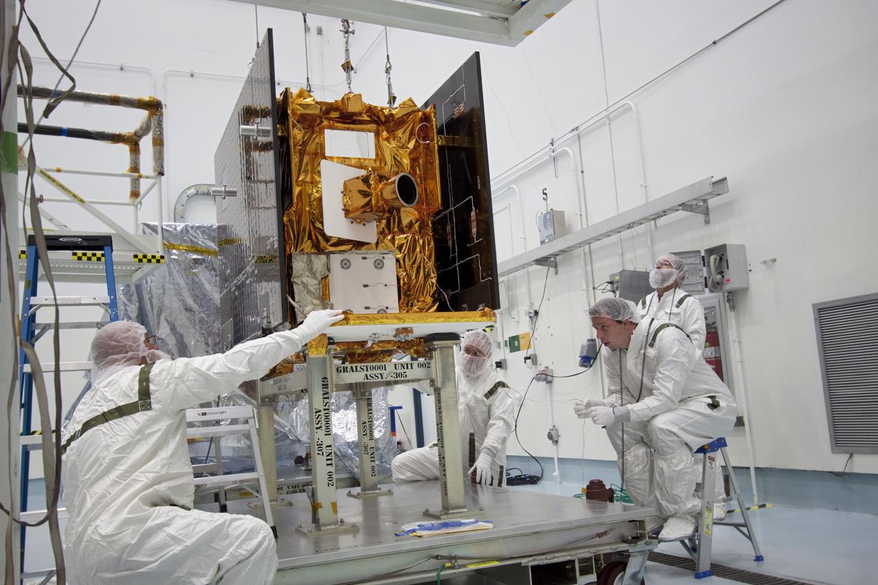 CAPE CANAVERAL, Fla. -- At Astrotech Space Operation's payload processing facility in Titusville, Fla., Lockheed Martin technicians secure a portable scale to one of NASA's twin Gravity Recovery and Interior Laboratory lunar spacecraft. The spacecraft will be lifted and weighed before they are stacked in their launch configuration in preparation for transport to the launch pad. GRAIL will fly in tandem orbits around the moon for several months to measure its gravity field. GRAIL's primary science objectives are to determine the structure of the lunar interior, from crust to core, and to advance understanding of the thermal evolution of the moon. Launch aboard a United Launch Alliance Delta II rocket from Space Launch Complex 17B on Cape Canaveral Air Force Station is scheduled for Sept. 8. For more information, visit http://www.nasa.gov/grail. Photo credit: NASA/Jim Grossmann