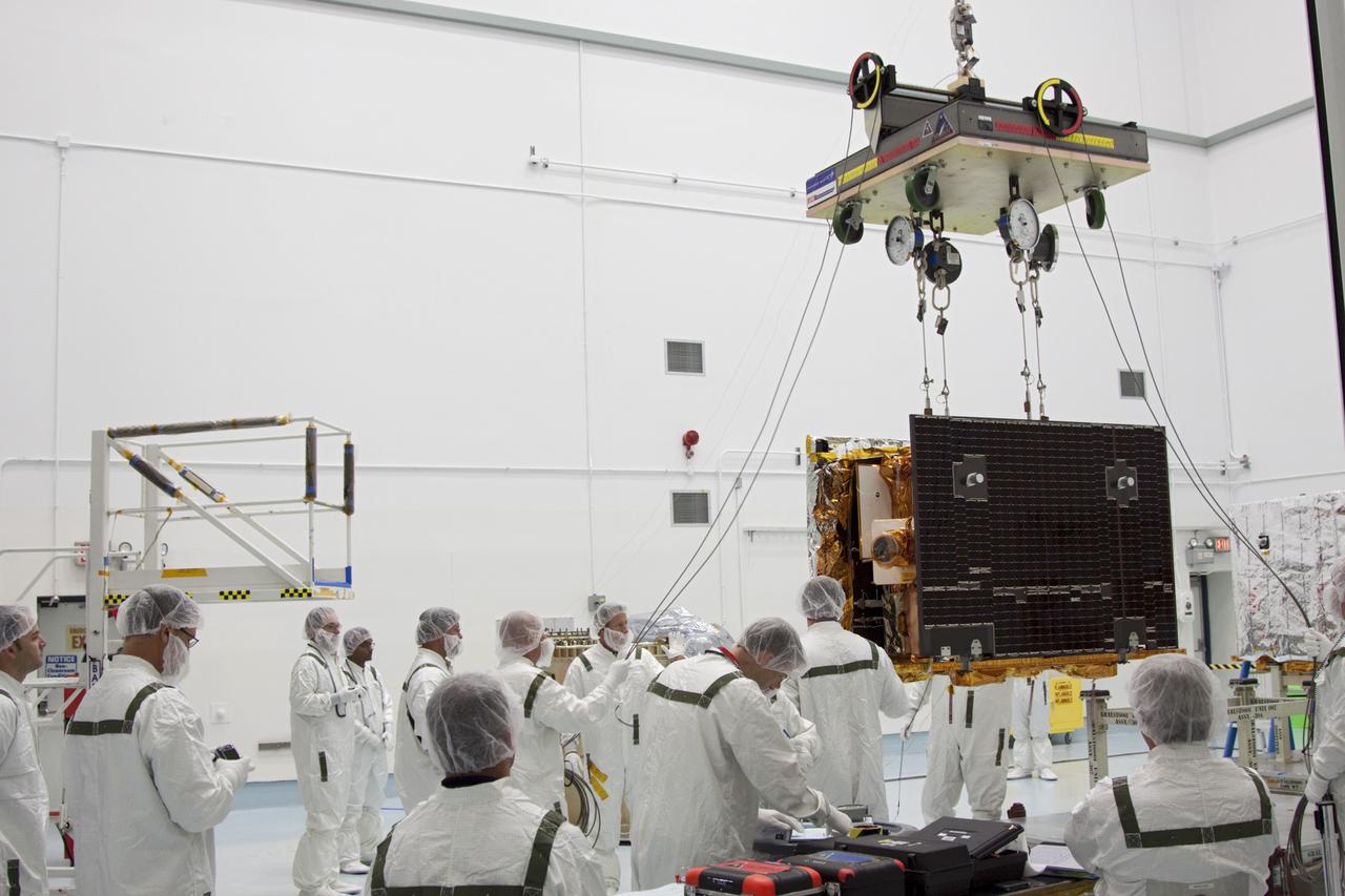CAPE CANAVERAL, Fla. -- At Astrotech Space Operation's payload processing facility in Titusville, Fla., Lockheed Martin technicians lift NASA's Gravity Recovery and Interior Laboratory-B (GRAIL-B) lunar probe from its workstand. After the twin GRAIL spacecraft are attached to their spacecraft adapter ring in their side-by-side launch configuration, they will be transported to the launch pad.    GRAIL will fly in tandem orbits around the moon for several months to measure its gravity field. GRAIL's primary science objectives are to determine the structure of the lunar interior, from crust to core, and to advance understanding of the thermal evolution of the moon.  Launch aboard a United Launch Alliance Delta II rocket from Space Launch Complex 17B on Cape Canaveral Air Force Station is scheduled for Sept. 8.  For more information, visit http://www.nasa.gov/grail. Photo credit: NASA/Jim Grossmann