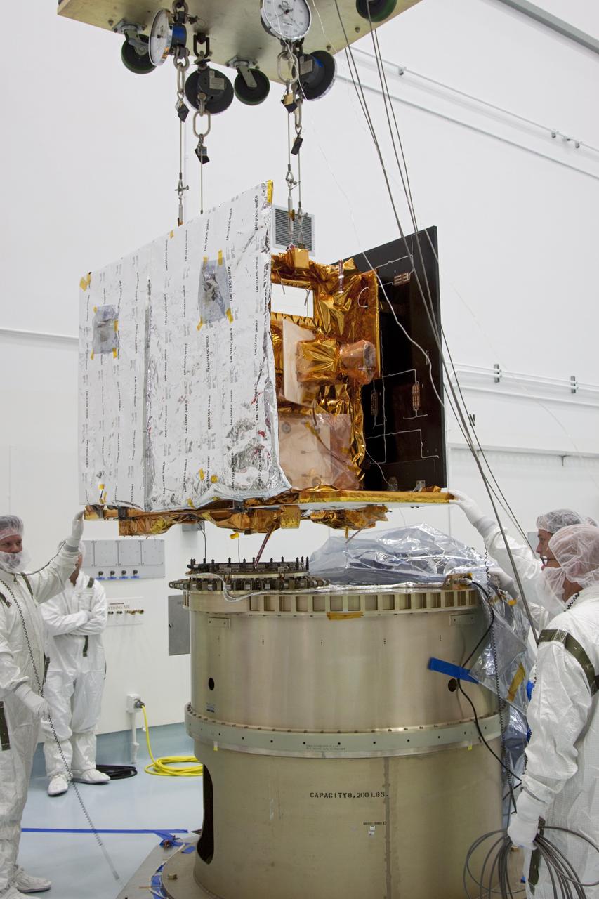 CAPE CANAVERAL, Fla. -- At Astrotech Space Operation's payload processing facility in Titusville, Fla., NASA's Gravity Recovery and Interior Laboratory-B (GRAIL-B) lunar probe is lowered toward the spacecraft adapter ring. After the twin GRAIL spacecraft are attached to the adapter ring in their side-by-side launch configuration, they will be transported to the launch pad.    GRAIL will fly in tandem orbits around the moon for several months to measure its gravity field. GRAIL's primary science objectives are to determine the structure of the lunar interior, from crust to core, and to advance understanding of the thermal evolution of the moon.  Launch aboard a United Launch Alliance Delta II rocket from Space Launch Complex 17B on Cape Canaveral Air Force Station is scheduled for Sept. 8.  For more information, visit http://www.nasa.gov/grail. Photo credit: NASA/Jim Grossmann
