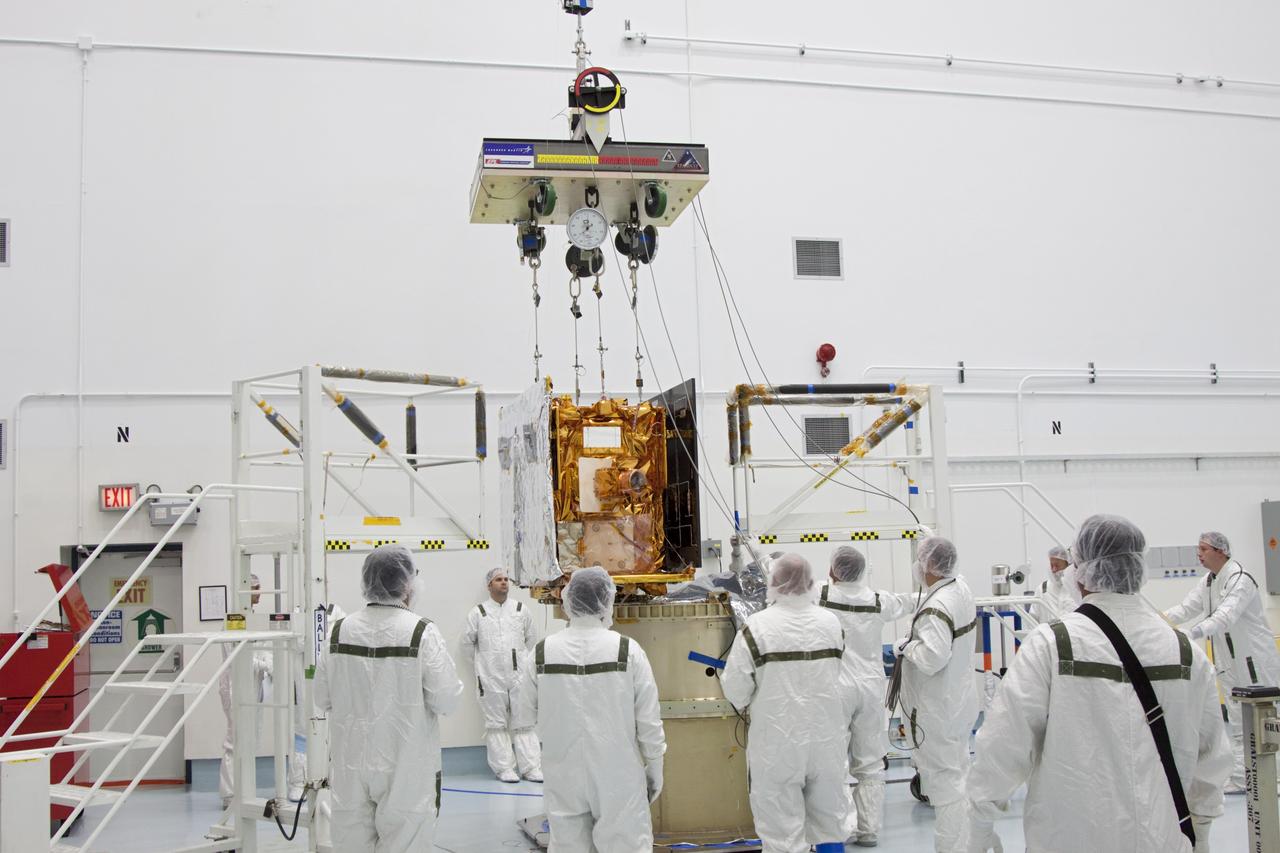 CAPE CANAVERAL, Fla. -- At Astrotech Space Operation's payload processing facility in Titusville, Fla., the lifting device is detached from NASA's Gravity Recovery and Interior Laboratory-B (GRAIL-B) lunar probe following its placement on the spacecraft adapter ring. After the twin GRAIL spacecraft are attached to the adapter ring in their side-by-side launch configuration, they will be transported to the launch pad.    GRAIL will fly in tandem orbits around the moon for several months to measure its gravity field. GRAIL's primary science objectives are to determine the structure of the lunar interior, from crust to core, and to advance understanding of the thermal evolution of the moon.  Launch aboard a United Launch Alliance Delta II rocket from Space Launch Complex 17B on Cape Canaveral Air Force Station is scheduled for Sept. 8.  For more information, visit http://www.nasa.gov/grail. Photo credit: NASA/Jim Grossmann