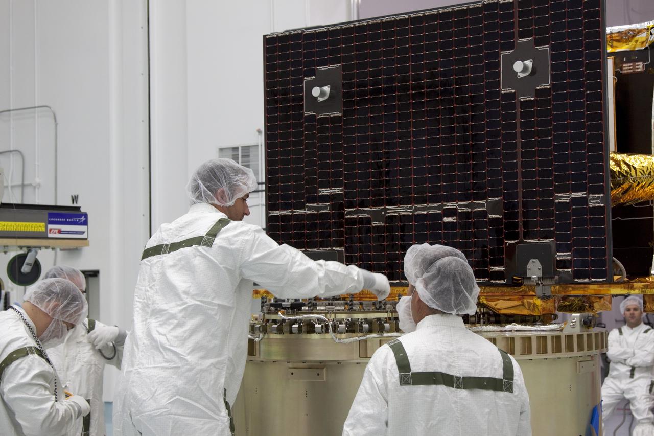 CAPE CANAVERAL, Fla. -- At Astrotech Space Operation's payload processing facility in Titusville, Fla., a Lockheed Martin technician secures NASA's Gravity Recovery and Interior Laboratory-B (GRAIL-B) lunar probe on the spacecraft adapter ring. After the twin GRAIL spacecraft are attached to the adapter ring in their side-by-side launch configuration, they will be transported to the launch pad. GRAIL will fly in tandem orbits around the moon for several months to measure its gravity field. GRAIL's primary science objectives are to determine the structure of the lunar interior, from crust to core, and to advance understanding of the thermal evolution of the moon. Launch aboard a United Launch Alliance Delta II rocket from Space Launch Complex 17B on Cape Canaveral Air Force Station is scheduled for Sept. 8. For more information, visit http://www.nasa.gov/grail. Photo credit: NASA/Jim Grossmann