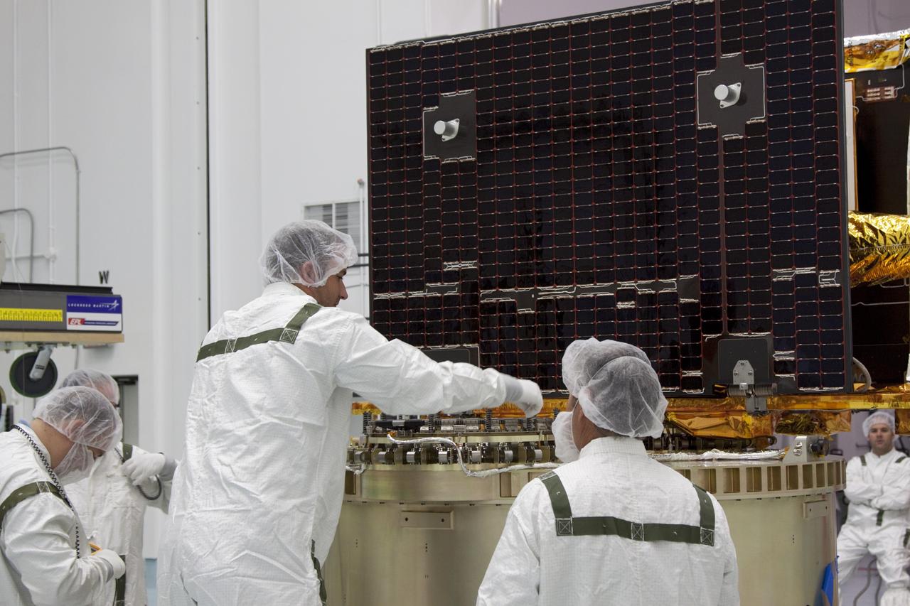 CAPE CANAVERAL, Fla. -- At Astrotech Space Operation's payload processing facility in Titusville, Fla., NASA's Gravity Recovery and Interior Laboratory-B (GRAIL-B) lunar probe is secured on the spacecraft adapter ring. After the twin GRAIL spacecraft are attached to the adapter ring in their side-by-side launch configuration, they will be transported to the launch pad.    GRAIL will fly in tandem orbits around the moon for several months to measure its gravity field. GRAIL's primary science objectives are to determine the structure of the lunar interior, from crust to core, and to advance understanding of the thermal evolution of the moon.  Launch aboard a United Launch Alliance Delta II rocket from Space Launch Complex 17B on Cape Canaveral Air Force Station is scheduled for Sept. 8.  For more information, visit http://www.nasa.gov/grail. Photo credit: NASA/Jim Grossmann