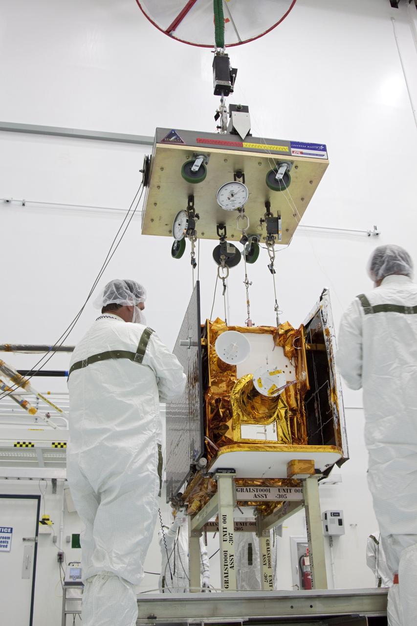 CAPE CANAVERAL, Fla. -- At Astrotech Space Operation's payload processing facility in Titusville, Fla., a lifting device is attached to NASA's Gravity Recovery and Interior Laboratory-A (GRAIL-A) lunar probe to move it from its workstand. After the twin GRAIL spacecraft are attached to the adapter ring in their side-by-side launch configuration, they will be transported to the launch pad.    GRAIL will fly in tandem orbits around the moon for several months to measure its gravity field. GRAIL's primary science objectives are to determine the structure of the lunar interior, from crust to core, and to advance understanding of the thermal evolution of the moon.  Launch aboard a United Launch Alliance Delta II rocket from Space Launch Complex 17B on Cape Canaveral Air Force Station is scheduled for Sept. 8.  For more information, visit http://www.nasa.gov/grail. Photo credit: NASA/Jim Grossmann
