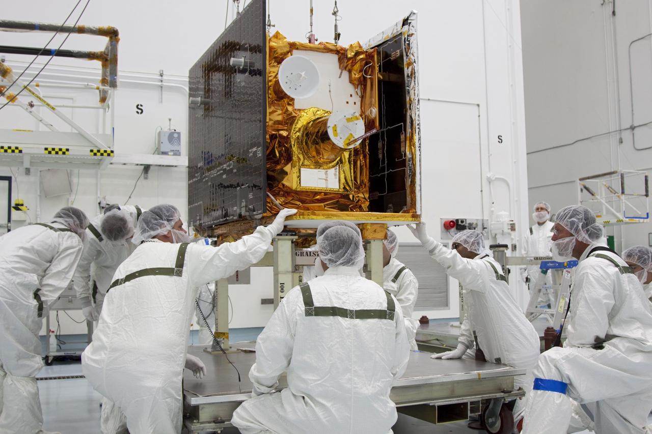 CAPE CANAVERAL, Fla. -- At Astrotech Space Operation's payload processing facility in Titusville, Fla., Lockheed Martin technicians verify that NASA's Gravity Recovery and Interior Laboratory-A (GRAIL-A) lunar probe is lifted carefully from its workstand. After the twin GRAIL spacecraft are attached to the adapter ring in their side-by-side launch configuration, they will be transported to the launch pad.    GRAIL will fly in tandem orbits around the moon for several months to measure its gravity field. GRAIL's primary science objectives are to determine the structure of the lunar interior, from crust to core, and to advance understanding of the thermal evolution of the moon.  Launch aboard a United Launch Alliance Delta II rocket from Space Launch Complex 17B on Cape Canaveral Air Force Station is scheduled for Sept. 8.  For more information, visit http://www.nasa.gov/grail. Photo credit: NASA/Jim Grossmann