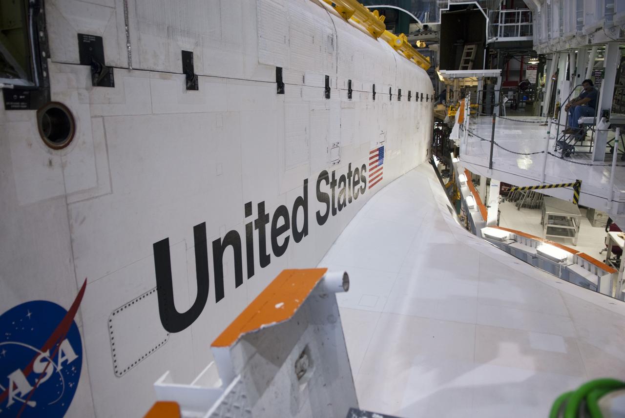 CAPE CANAVERAL, Fla. -- At NASA's Kennedy Space Center in Florida, the emblems along the body of space shuttle Endeavour are seen as preparations are made to move the spacecraft to the Vehicle Assembly Building (VAB).  Endeavour is switching places with shuttle Discovery which temporarily has been stored in the VAB.  Both shuttles will stop briefly outside OPF-3 for a "nose-to-nose" photo opportunity. Discovery then will be rolled into OPF-1 and Endeavour into the VAB.    In OPF-1, Discovery will undergo further preparations for public display at the Smithsonian's National Air and Space Museum Steven F. Udvar-Hazy Center in Virginia. Endeavour will be stored in the VAB until October when it will be moved into OPF-2 for further work to get it ready for public display at the California Science Center in Los Angeles.  For more information, visit http://www.nasa.gov/shuttle. Photo credit: NASA/Jim Grossmann