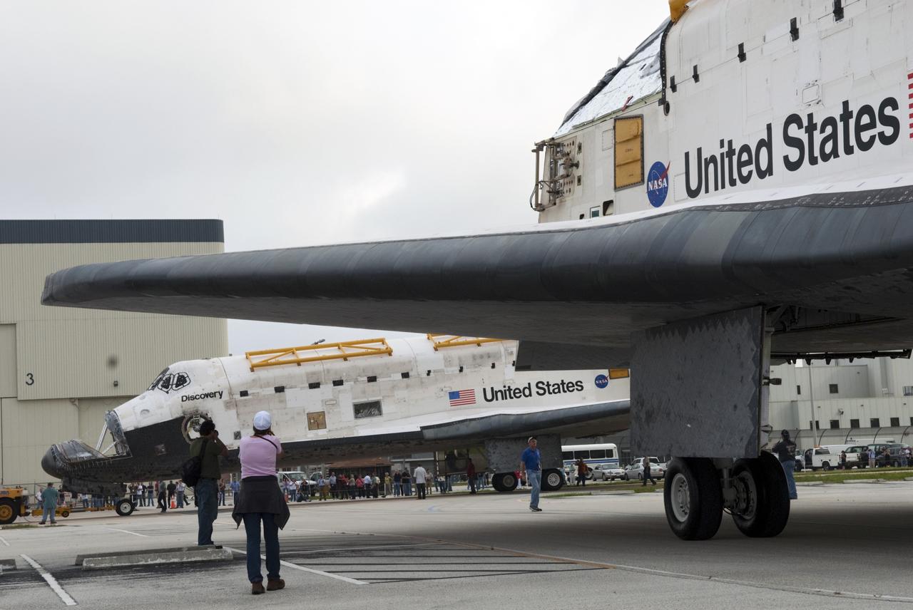 CAPE CANAVERAL, Fla. -- At NASA's Kennedy Space Center in Florida, space shuttles Discovery and Endeavour go their separate ways outside Orbiter Processing Facility-3 (OPF-3) where they paused for a unique "nose-to-nose" photo opportunity.  Discovery, which temporarily was being stored in the Vehicle Assembly Building (VAB), is switching places with Endeavour, which has been undergoing decommissioning in OPF-1.  Discovery will be rolled into OPF-1 and Endeavour into the VAB.    In OPF-1, Discovery will undergo further preparations for public display at the Smithsonian's National Air and Space Museum Steven F. Udvar-Hazy Center in Virginia. Endeavour will be stored in the VAB until October when it will be moved into OPF-2 for further work to get it ready for public display at the California Science Center in Los Angeles.  For more information, visit http://www.nasa.gov/shuttle. Photo credit: NASA/Jim Grossmann