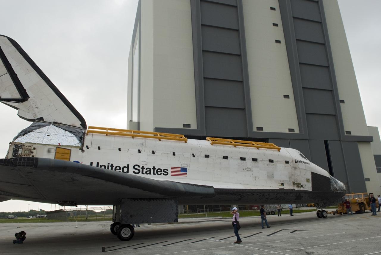 CAPE CANAVERAL, Fla. -- At NASA's Kennedy Space Center in Florida, space shuttle Endeavour nears the Vehicle Assembly Building (VAB), where it temporarily will be stored.  Endeavour is swapping places with Discovery, which will resume decommissioning activities in Orbiter Processing Facility-1 (OPF-1).  The shuttles stopped briefly outside OPF-3 for a unique "nose-to-nose" photo opportunity.    In OPF-1, Discovery will undergo further preparations for public display at the Smithsonian's National Air and Space Museum Steven F. Udvar-Hazy Center in Virginia. Endeavour will be stored in the VAB until October when it will be moved into OPF-2 for further work to get it ready for public display at the California Science Center in Los Angeles.  For more information, visit http://www.nasa.gov/shuttle. Photo credit: NASA/Jim Grossmann