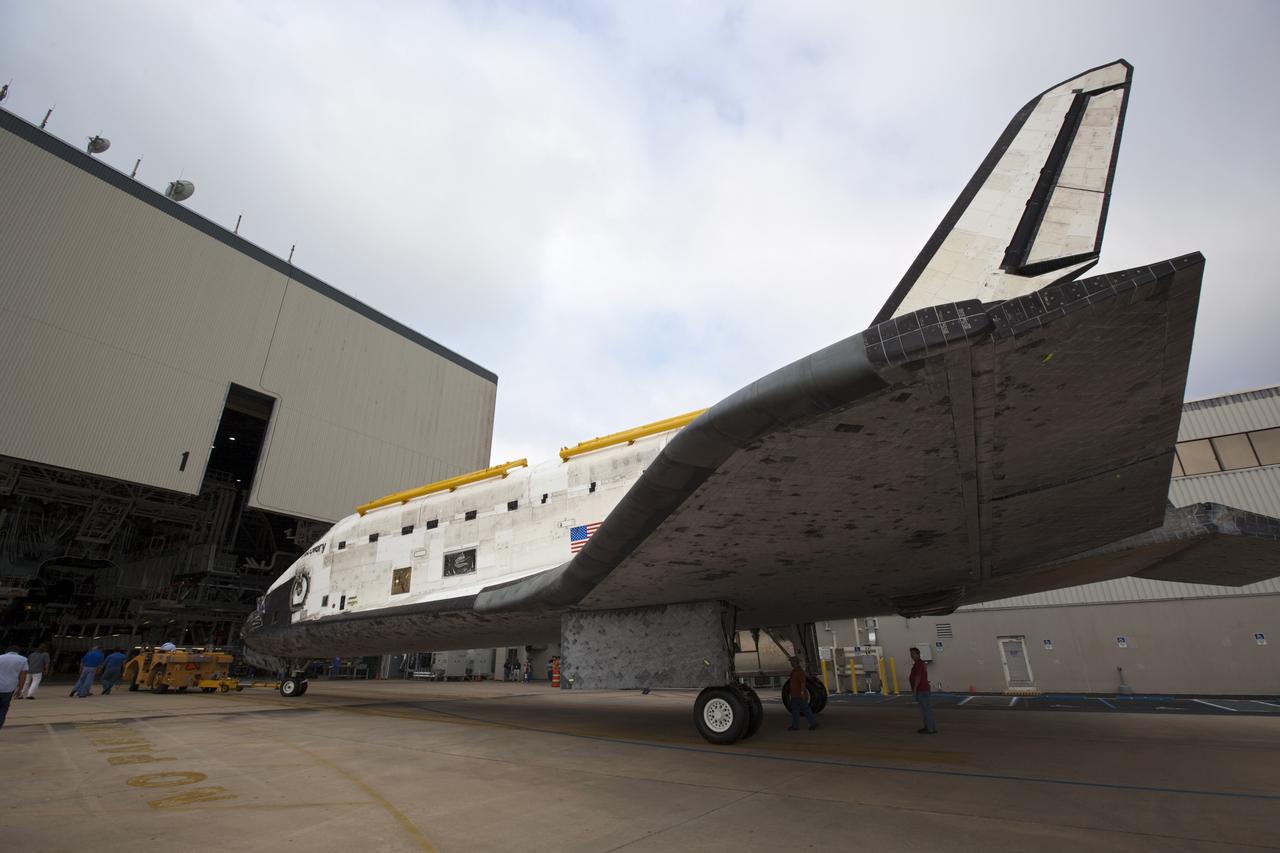 CAPE CANAVERAL, Fla. -- At NASA's Kennedy Space Center in Florida, space shuttle Discovery is ready to enter  Orbiter Processing Facility-1 (OPF-1) after participating in a unique "nose-to-nose" photo opportunity outside OPF-3 with shuttle Endeavour. Discovery is switching places with shuttle Endeavour which temporarily is being placed in storage in the Vehicle Assembly Building (VAB).     In OPF-1, Discovery will undergo further preparations for public display at the Smithsonian's National Air and Space Museum Steven F. Udvar-Hazy Center in Virginia. Endeavour will be stored in the VAB until October when it will be moved into OPF-2 for further work to get it ready for public display at the California Science Center in Los Angeles.  For more information, visit http://www.nasa.gov/shuttle. Photo credit: NASA/Dimitri Gerondidakis
