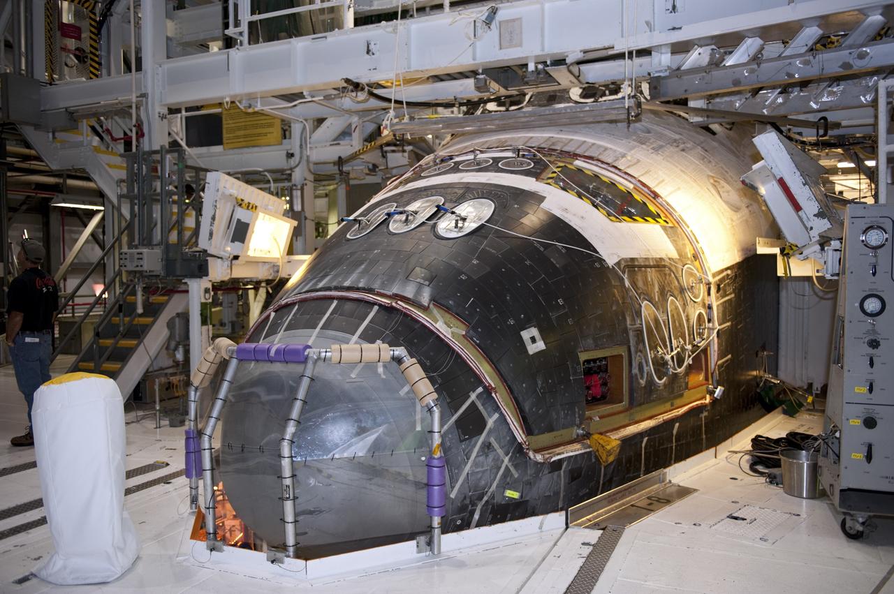 CAPE CANAVERAL, Fla. -- In Orbiter Processing Facility-2 (OPF-2) at NASA’s Kennedy Space Center in Florida, work begins to remove space shuttle Atlantis’ forward reaction control system. The system provided maneuvering capabilities to the spacecraft during its missions. Atlantis glided to a landing, July 21, 2011, at Kennedy Space Center’s Shuttle Landing Facility, completing NASA’s final space shuttle mission, STS-135. The shuttle is in OPF-2 being decommissioned and prepared for eventual display at the Kennedy Space Center Visitor Complex in Florida. Photo credit: Kim Shiflett