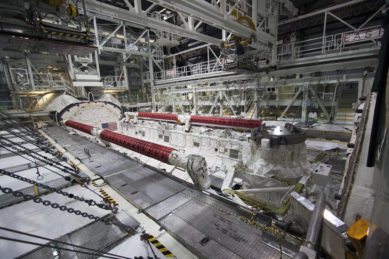 CAPE CANAVERAL, Fla. -- In Orbiter Processing Facility-2 (OPF-2) at NASA’s Kennedy Space Center in Florida, space shuttle Atlantis’ payload bay is open. Earlier, a special crane was used to remove Atlantis’ forward reaction control system. The system, which provided maneuvering capabilities to the spacecraft during its missions, will be transported to White Sands Space Harbor in New Mexico to undergo a complete deservicing and cleaning. Atlantis glided to a landing, July 21, 2011, at Kennedy Space Center’s Shuttle Landing Facility, completing NASA’s final space shuttle mission, STS-135. The shuttle is in OPF-2 being decommissioned and prepared for eventual display at the Kennedy Space Center Visitor Complex in Florida. Photo credit: Jim Grossmann