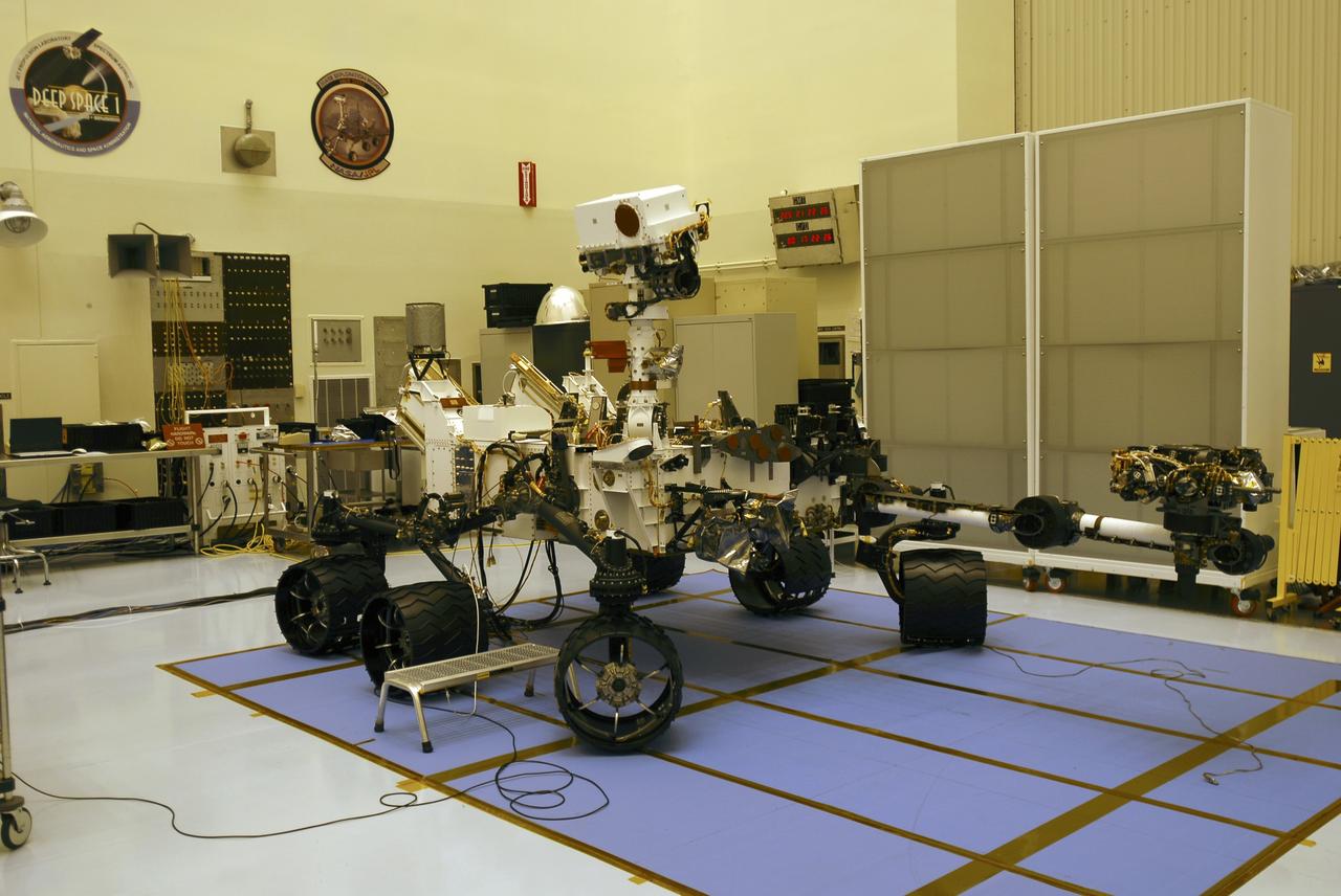 CAPE CANAVERAL, Fla. -- In the Payload Hazardous Servicing Facility at NASA's Kennedy Space Center in Florida, preparations are under way to stow the robotic arm on the Mars Science Laboratory (MSL) rover, Curiosity. The arm will hold and maneuver instruments that will help scientists analyze Martian rocks and soil. Much like a human arm, the robotic arm has flexibility through shoulder, elbow, and wrist joints that permit the arm to extend, bend, and angle precisely against rocks and soil to grind away layers, take microscopic images and analyze their elemental composition. At the end of the arm is a hand-like structure, the turret, for holding various tools that can spin through a 350-degree turning range. A United Launch Alliance Atlas V-541 configuration will be used to loft MSL into space. Curiosity’s 10 science instruments are designed to search for evidence on whether Mars has had environments favorable to microbial life, including chemical ingredients for life. The unique rover will use a laser to look inside rocks and release its gasses so that the rover’s spectrometer can analyze and send the data back to Earth. MSL is scheduled to launch Nov. 25 from Space Launch Complex 41 on Cape Canaveral Air Force Station in Florida. For more information, visit http://www.nasa.gov/msl. Photo credit: NASA/Charisse Nahser