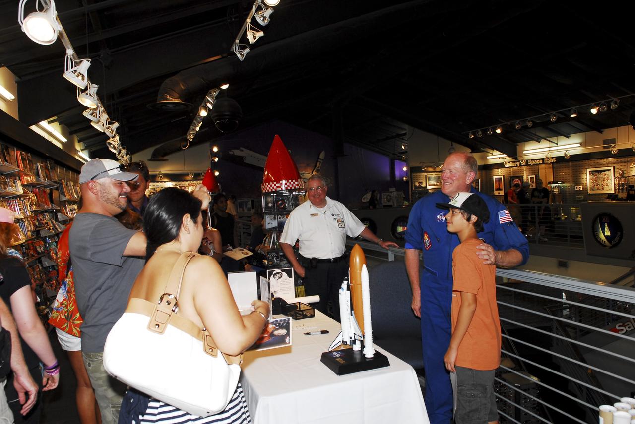 CAPE CANAVERAL, Fla. -- Three-time space shuttle astronaut Charles D. "Sam" Gemar signs autographs and takes photos with space shuttle workers and their families at the “We Made History! Shuttle Program Celebration,” Aug. 13, at the Kennedy Space Center Visitor Complex, Fla. The event was held to honor shuttle workers’ dedication to NASA’s Space Shuttle Program and to celebrate 30 years of space shuttle achievements. The event featured food, music, entertainment, astronaut appearances, educational activities, giveaways, and Starfire Night Skyshow. Photo credit: Jim Grossmann