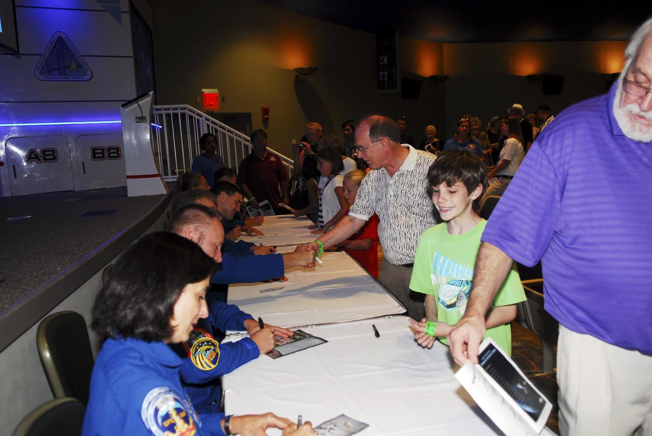 CAPE CANAVERAL, Fla. -- Some veteran space shuttle fliers sign autographs and talk with shuttle workers and their families at the “We Made History! Shuttle Program Celebration,” Aug. 13, at the Kennedy Space Center Visitor Complex, Fla. The event was held to honor shuttle workers’ dedication to NASA’s Space Shuttle Program and to celebrate 30 years of space shuttle achievements.  The event featured food, music, entertainment, astronaut appearances, educational activities, giveaways, and Starfire Night Skyshow. Photo credit: Jim Grossmann