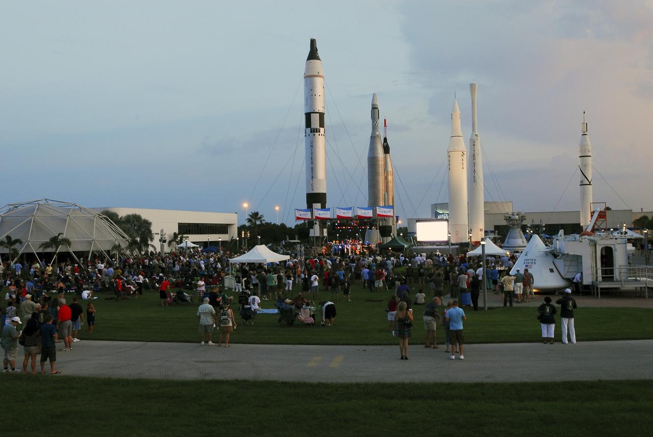 CAPE CANAVERAL, Fla. -- Thousands of space shuttle workers and their families gather near the Rocket Garden at the Kennedy Space Center Visitor Complex in Florida for the “We Made History! Shuttle Program Celebration” on Aug. 13. The event was held to honor current and former workers’ dedication to NASA’s Space Shuttle Program and to celebrate 30 years of space shuttle achievements.  The event featured food, music, entertainment, astronaut appearances, educational activities, giveaways, and Starfire Night Skyshow. Photo credit: Jim Grossmann