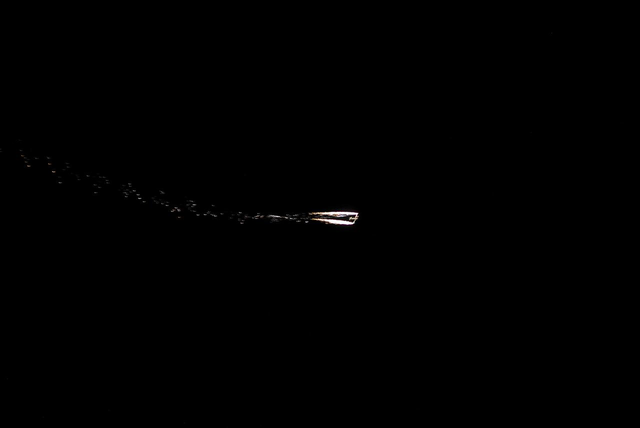 CAPE CANAVERAL, Fla. -- A Starfire Night Skyshow takes place above the Kennedy Space Center Visitor Complex in Florida during the “We Made History! Shuttle Program Celebration” on Aug. 13. The event was held to honor shuttle workers’ dedication to NASA’s Space Shuttle Program and to celebrate 30 years of space shuttle achievements. The show featured spectacular night aerobatics with special computer-controlled lighting and firework effects on a plane flown by experienced pilot Bill Leff. The event also featured food, music, entertainment, astronaut appearances, educational activities and giveaways. Photo credit: Jim Grossmann