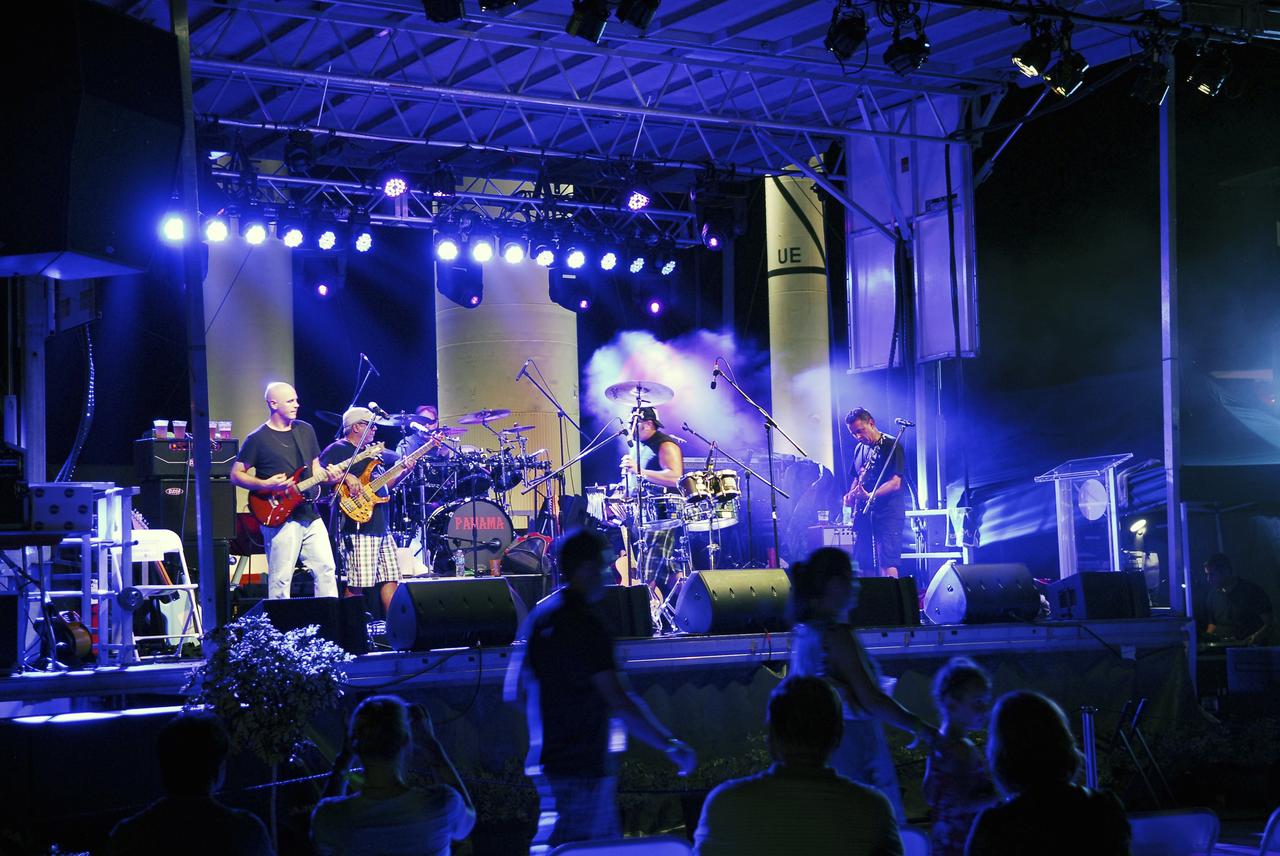 CAPE CANAVERAL, Fla. – The Panama band entertains thousands of space shuttle workers and their families at the “We Made History! Shuttle Program Celebration,” Aug. 13, at the Kennedy Space Center Visitor Complex, Fla. The event was held to honor current and former workers’ dedication to NASA’s Space Shuttle Program and to celebrate 30 years of space shuttle achievements.    The event featured food, music, entertainment, astronaut appearances, educational activities, giveaways, and Starfire Night Skyshow.   Photo credit: Jim Grossmann
