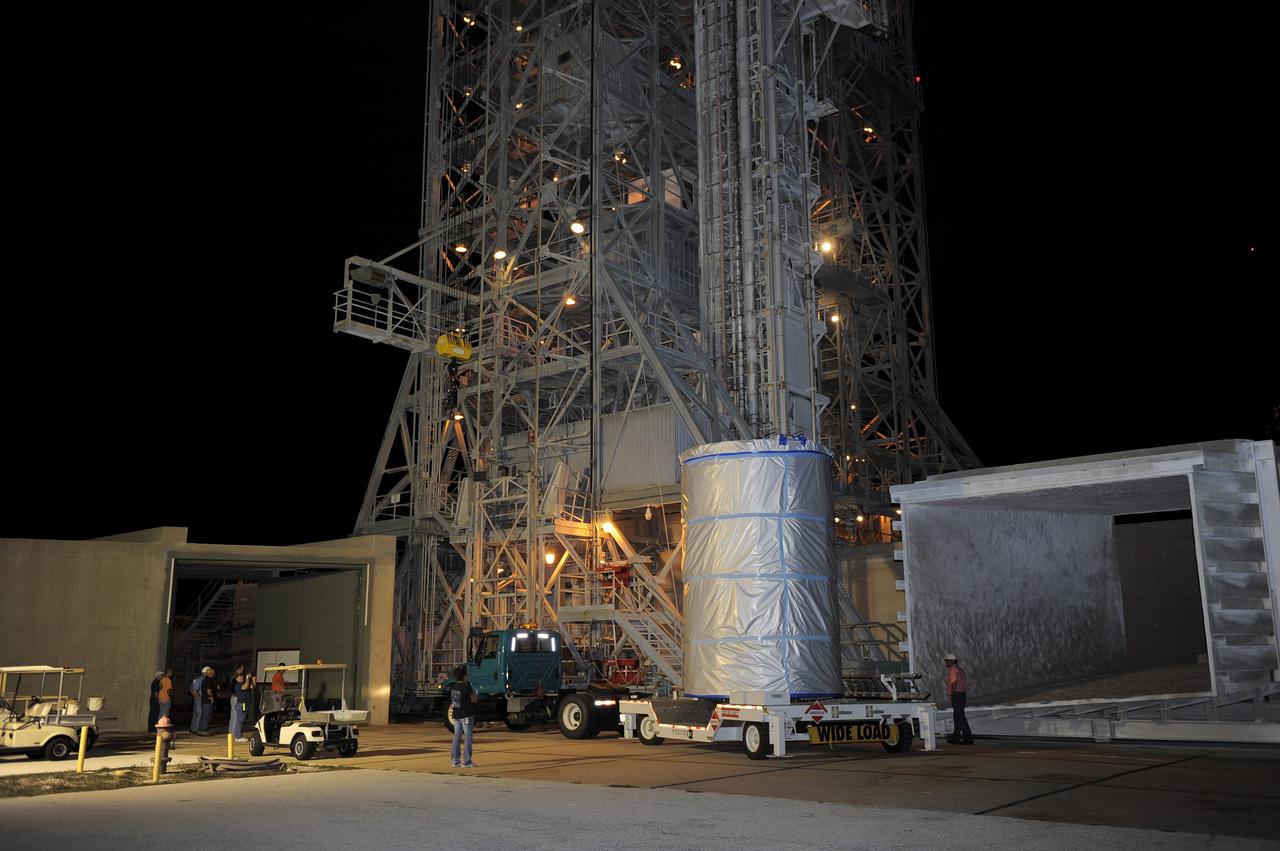 CAPE CANAVERAL, Fla. -- NASA's twin Gravity Recovery and Interior Laboratory (GRAIL) spacecraft arrives at their launch pad at Space Launch Complex 17B at Cape Canaveral Air Force Station in Florida. The lunar probes are attached to a spacecraft adapter ring in their side-by-side launch configuration and wrapped in plastic to prevent contamination outside the clean room in the Astrotech Space Operation's payload processing facility in Titusville, Fla.          The spacecraft will fly in tandem orbits around the moon for several months to measure its gravity field. GRAIL's primary science objectives are to determine the structure of the lunar interior, from crust to core, and to advance understanding of the thermal evolution of the moon.  Launch aboard a United Launch Alliance Delta II rocket is scheduled for Sept. 8. For more information, visit www.nasa.gov/grail. Photo credit: NASA/Kim Shiflett