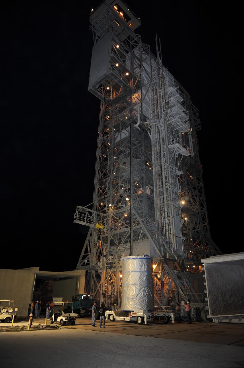 CAPE CANAVERAL, Fla. -- NASA's twin Gravity Recovery and Interior Laboratory (GRAIL) spacecraft arrives at their launch pad at Space Launch Complex 17B at Cape Canaveral Air Force Station in Florida. The lunar probes are attached to a spacecraft adapter ring in their side-by-side launch configuration and wrapped in plastic to prevent contamination outside the clean room in the Astrotech Space Operation's payload processing facility in Titusville, Fla.        The spacecraft will fly in tandem orbits around the moon for several months to measure its gravity field. GRAIL's primary science objectives are to determine the structure of the lunar interior, from crust to core, and to advance understanding of the thermal evolution of the moon.  Launch aboard a United Launch Alliance Delta II rocket is scheduled for Sept. 8. For more information, visit www.nasa.gov/grail. Photo credit: NASA/Kim Shiflett