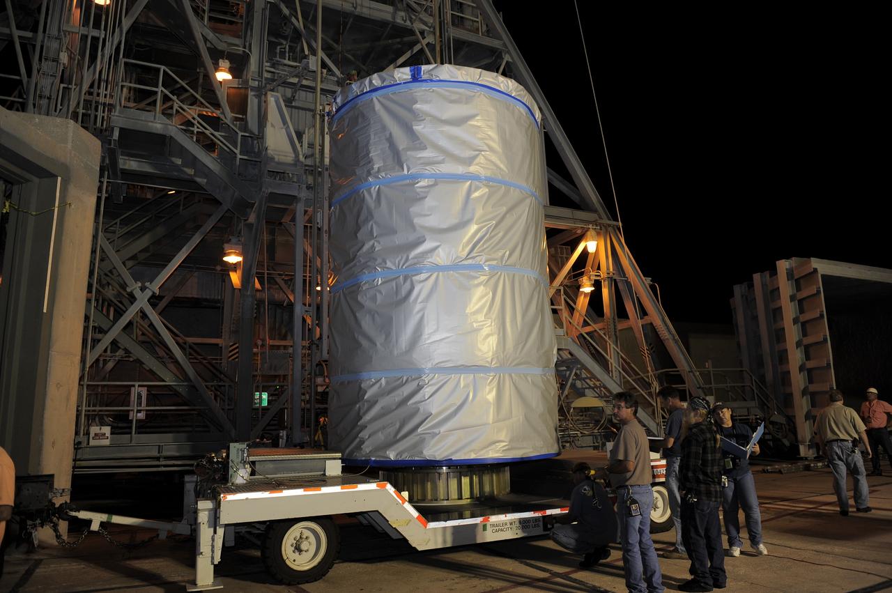 CAPE CANAVERAL, Fla. -- NASA's twin Gravity Recovery and Interior Laboratory (GRAIL) spacecraft will be lifted to the top of their launch pad at Space Launch Complex 17B at Cape Canaveral Air Force Station in Florida. The lunar probes are attached to a spacecraft adapter ring in their side-by-side launch configuration and wrapped in plastic to prevent contamination outside the clean room in the Astrotech Space Operation's payload processing facility in Titusville, Fla.      The spacecraft will fly in tandem orbits around the moon for several months to measure its gravity field. GRAIL's primary science objectives are to determine the structure of the lunar interior, from crust to core, and to advance understanding of the thermal evolution of the moon.  Launch aboard a United Launch Alliance Delta II rocket is scheduled for Sept. 8. For more information, visit www.nasa.gov/grail. Photo credit: NASA/Kim Shiflett