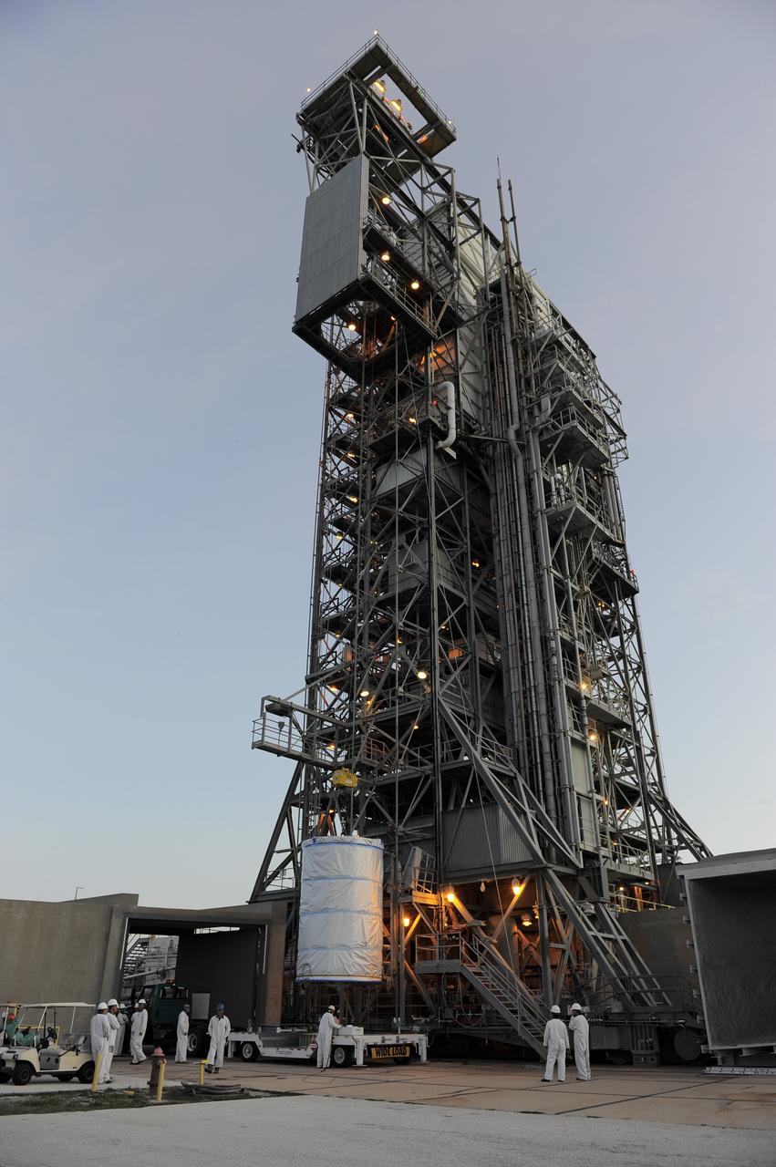 CAPE CANAVERAL, Fla. -- NASA's twin Gravity Recovery and Interior Laboratory (GRAIL) spacecraft are lifted to the top of their launch pad at Space Launch Complex 17B at Cape Canaveral Air Force Station in Florida. The lunar probes are attached to a spacecraft adapter ring in their side-by-side launch configuration and wrapped in plastic to prevent contamination outside the clean room in the Astrotech Space Operation's payload processing facility in Titusville, Fla.        The spacecraft will fly in tandem orbits around the moon for several months to measure its gravity field. GRAIL's primary science objectives are to determine the structure of the lunar interior, from crust to core, and to advance understanding of the thermal evolution of the moon.  Launch aboard a United Launch Alliance Delta II rocket is scheduled for Sept. 8. For more information, visit www.nasa.gov/grail. Photo credit: NASA/Kim Shiflett