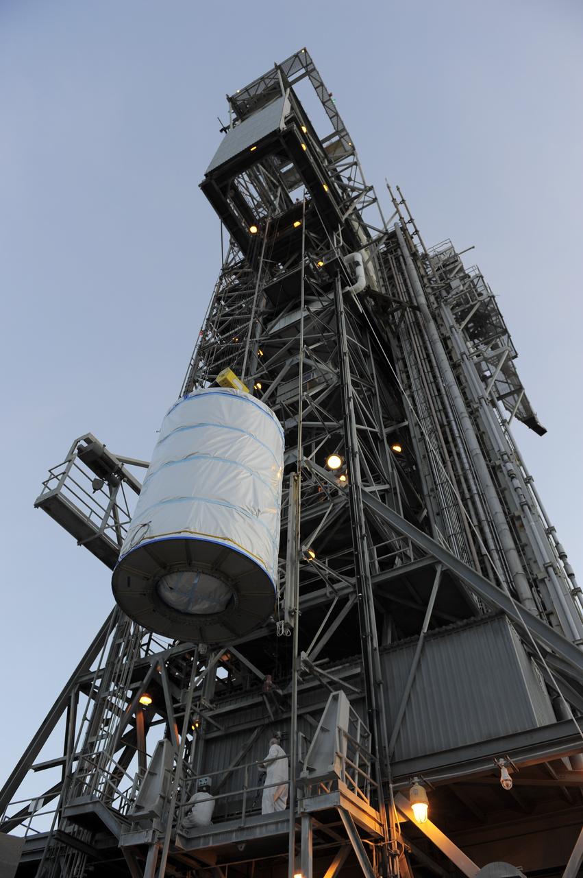CAPE CANAVERAL, Fla. -- NASA's twin Gravity Recovery and Interior Laboratory (GRAIL) spacecraft are lifted to the top of their launch pad at Space Launch Complex 17B at Cape Canaveral Air Force Station in Florida. The lunar probes are attached to a spacecraft adapter ring in their side-by-side launch configuration and wrapped in plastic to prevent contamination outside the clean room in the Astrotech Space Operation's payload processing facility in Titusville, Fla.      The spacecraft will fly in tandem orbits around the moon for several months to measure its gravity field. GRAIL's primary science objectives are to determine the structure of the lunar interior, from crust to core, and to advance understanding of the thermal evolution of the moon.  Launch aboard a United Launch Alliance Delta II rocket is scheduled for Sept. 8. For more information, visit www.nasa.gov/grail. Photo credit: NASA/Kim Shiflett